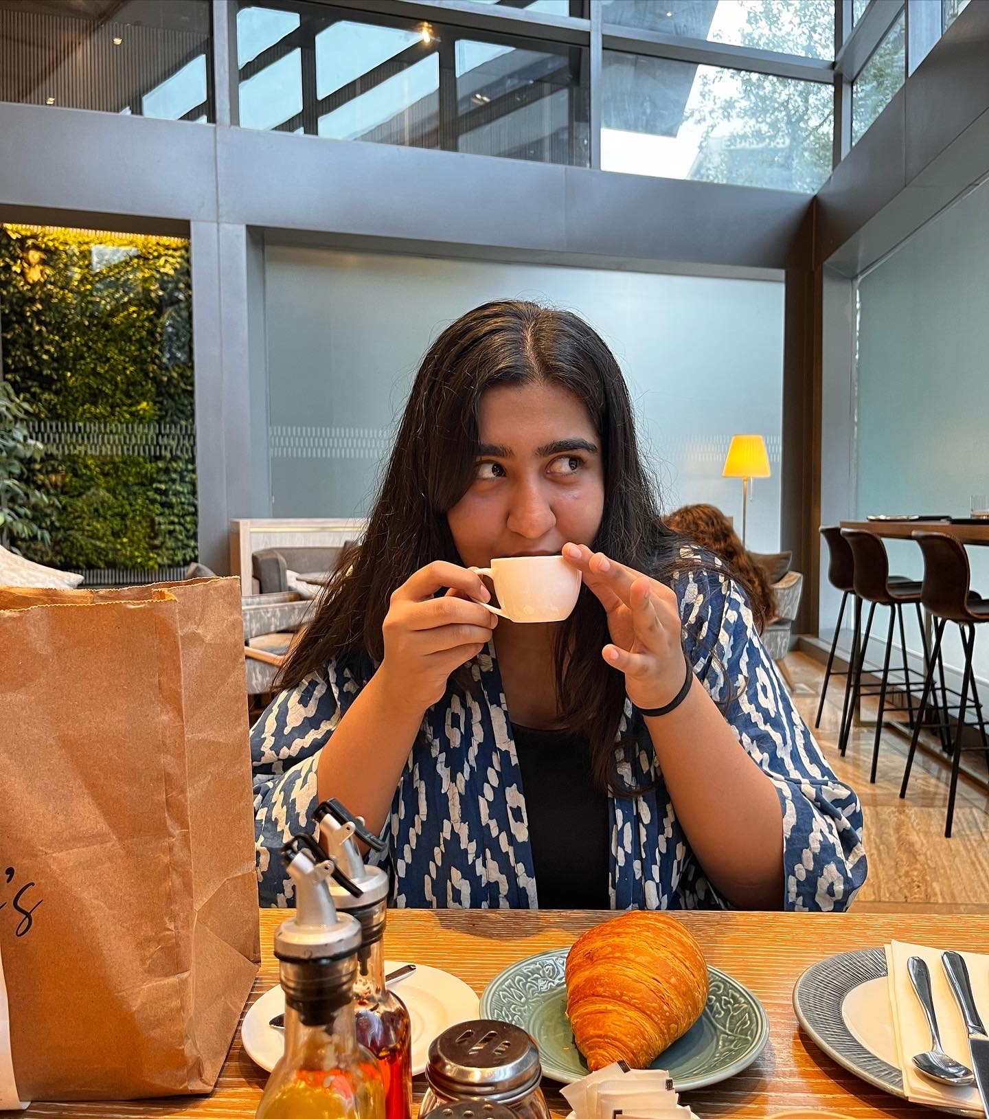 a blurry photo of a person standing in front of a wall