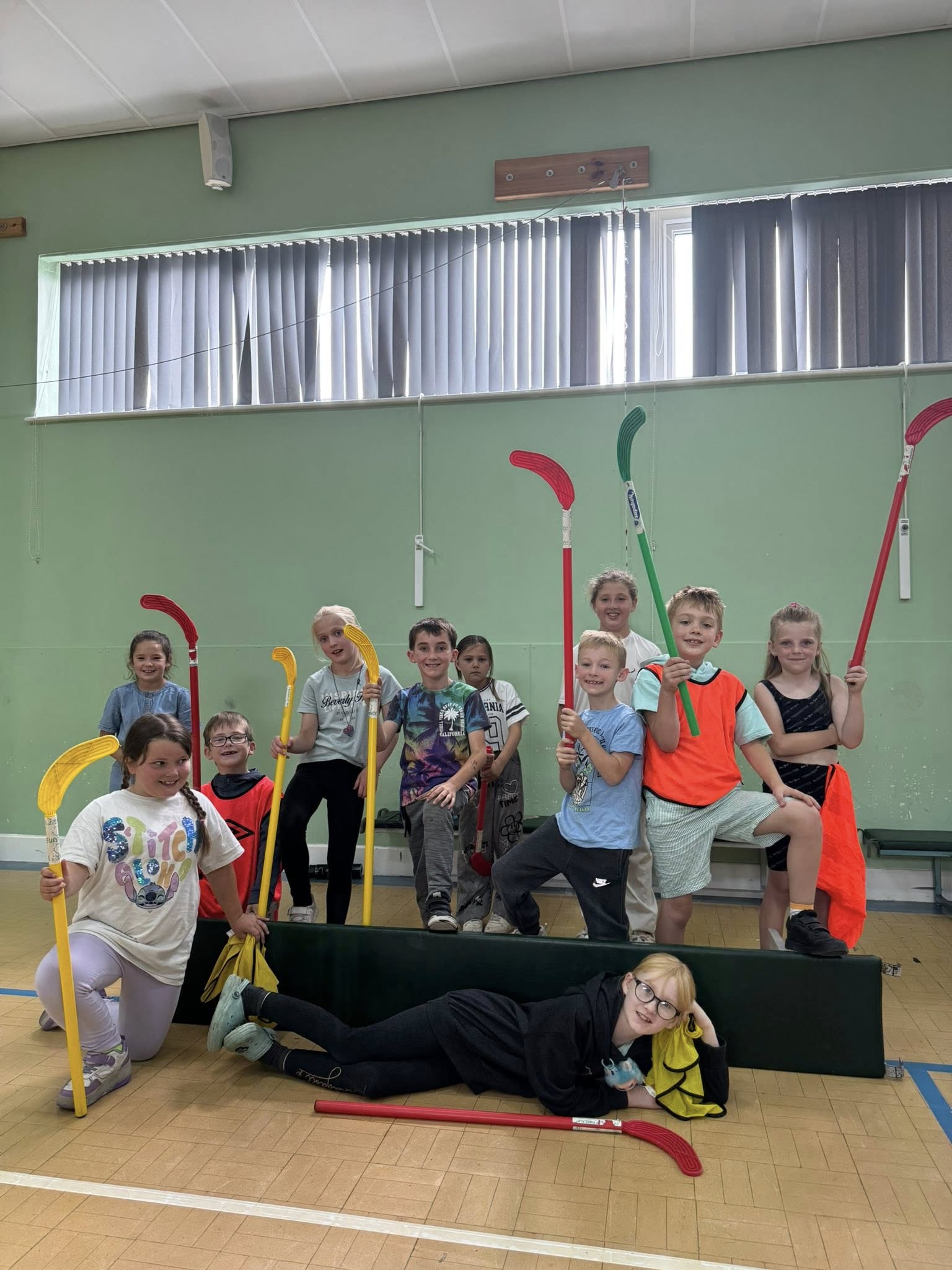 group of people playing soccer on green grass field during daytime