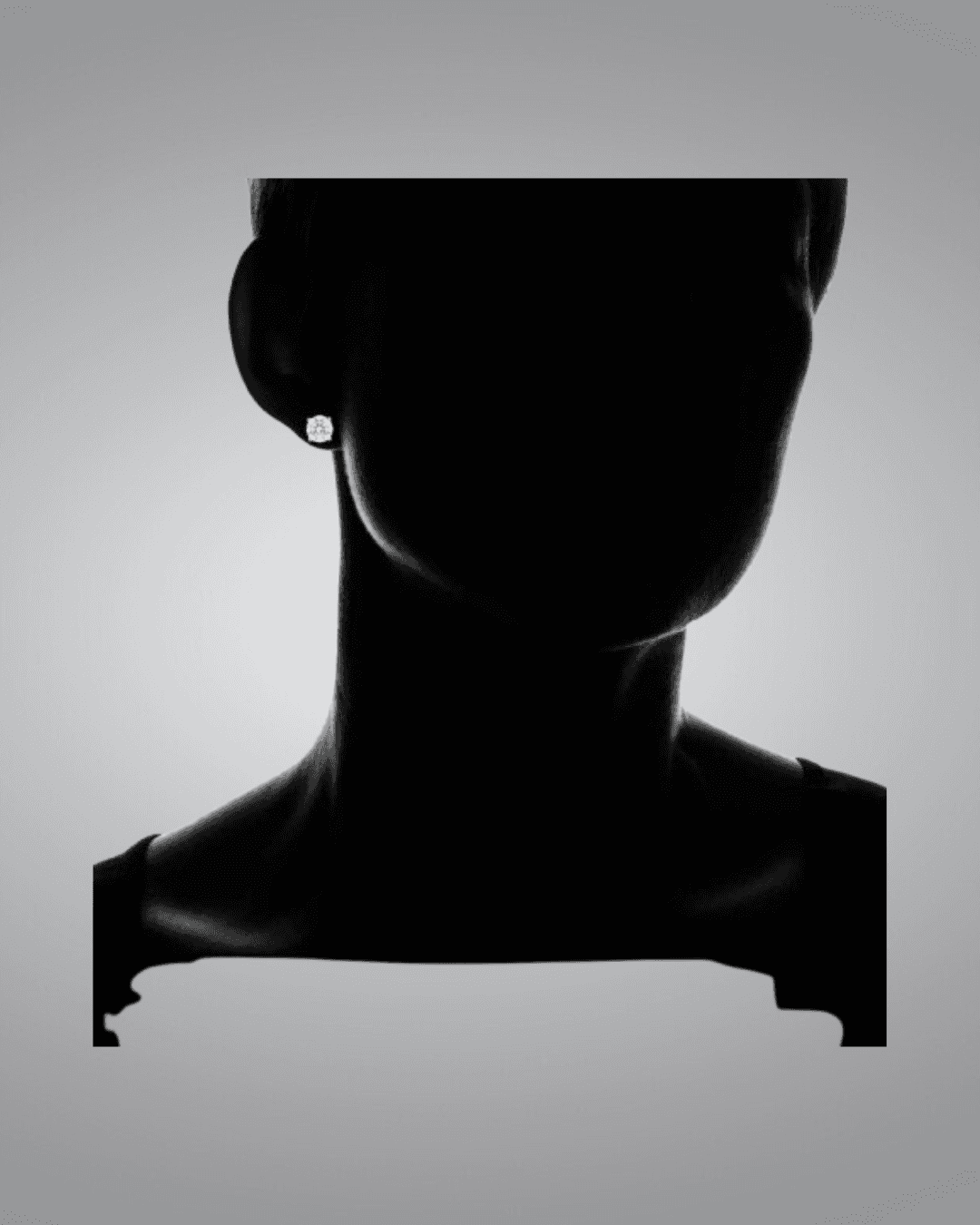 black mannequin  wearing earrings