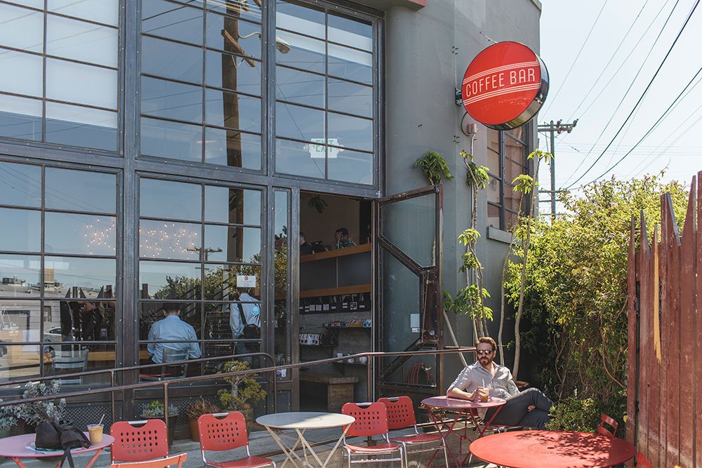 Ryan is shown here enjoying his morning iced coffee at Coffee Bar. The Mission is home to some of the best restaurants and coffeeshops in America.