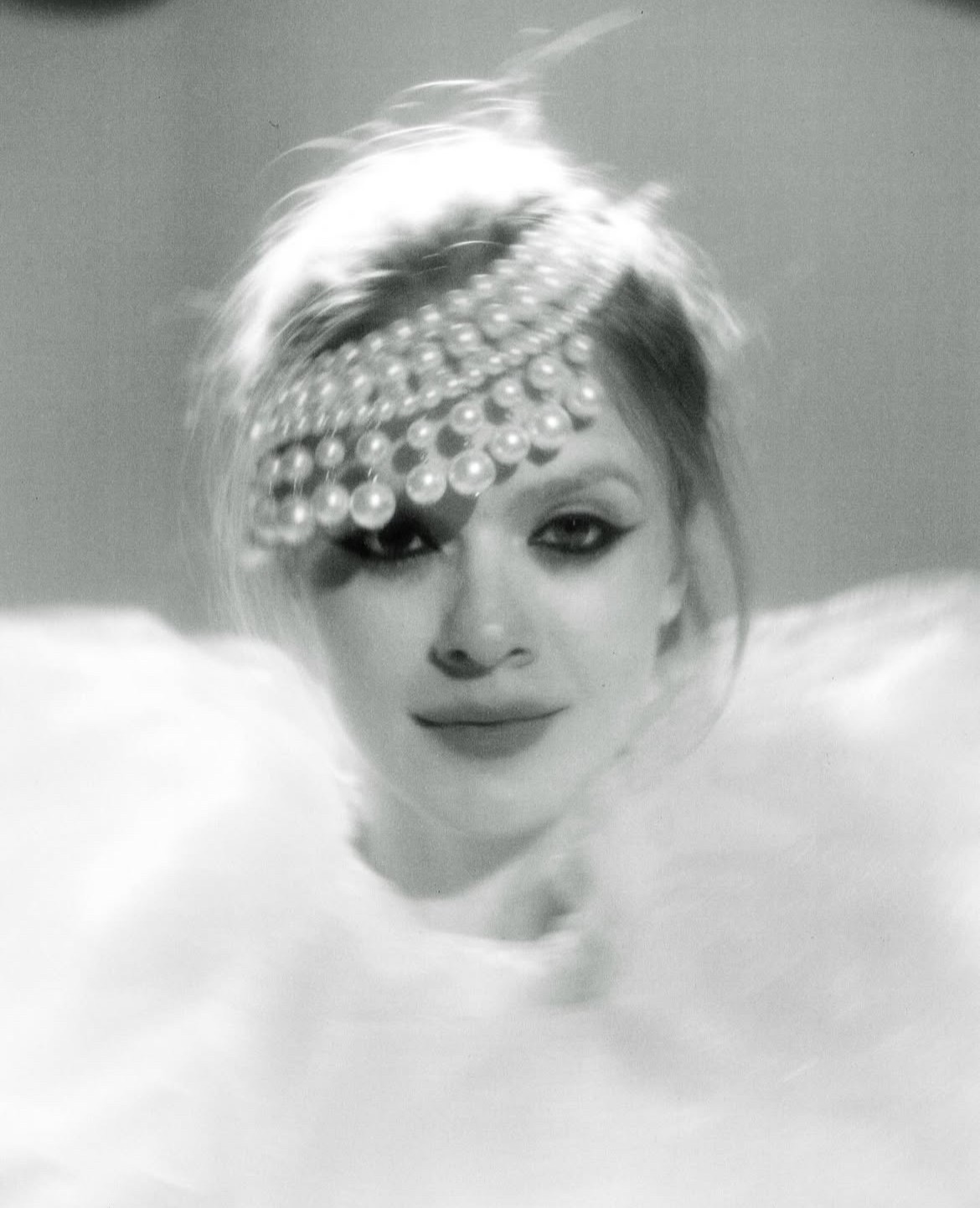 Fashion photoshoot with a woman posing in a dress