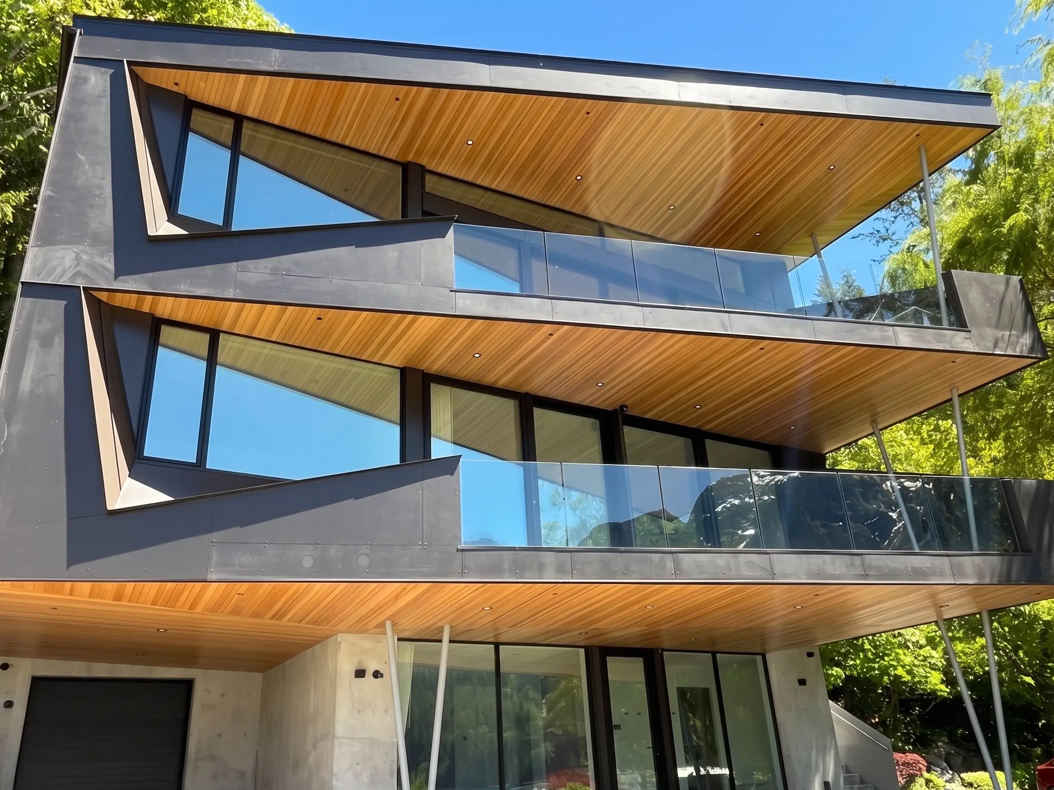 Contemporary multi-storey Parksville BC home featuring three cantilevered wood-clad balconies fronted by frameless glass railings.