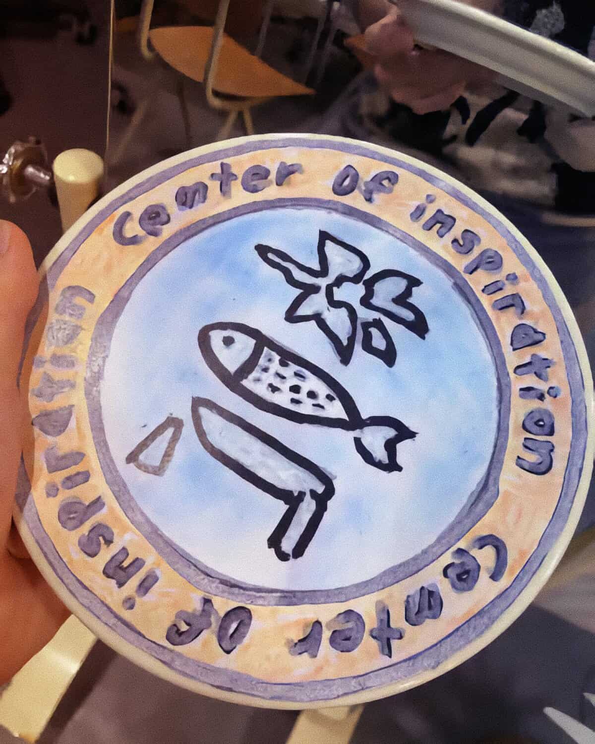 Logo công ty Suối nguồn cảm hứng (Center of Inspiration) của AKMU