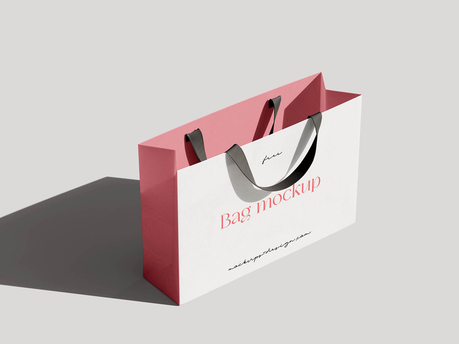 A refined mockup of a paper shopping bag with fabric handles, ideal for showcasing branding for fashion boutiques, cosmetics, or lifestyle products. The set offers four different PSD views—from front and side to angled shots—capturing the natural shadows and soft paper texture with realism. It’s a perfect choice for designers who want to present packaging designs in a polished and minimalistic setting. Easily customizable with smart objects to match any brand identity.