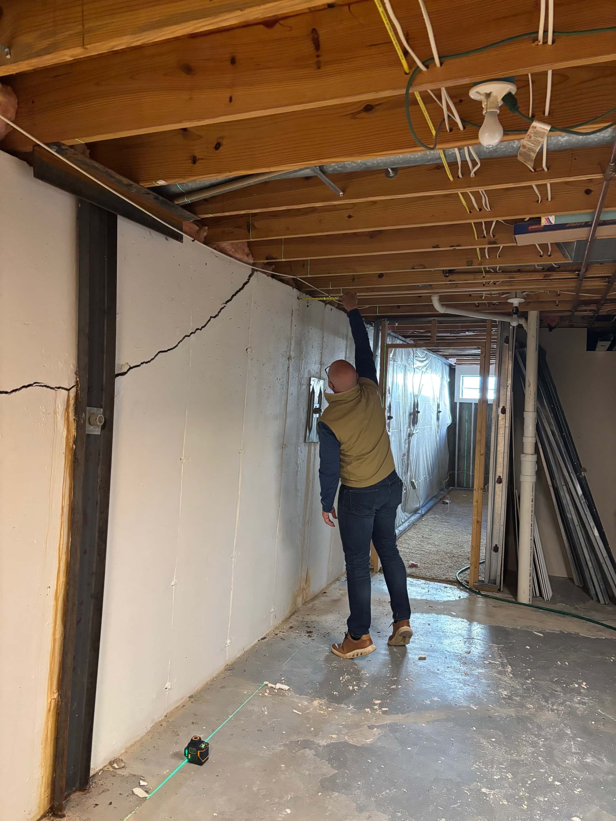 a St. Louis County basement with cracks and bowing walls due to soil and drainage issues