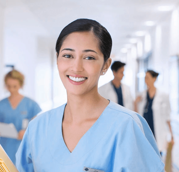 a woman in a white lab coat pointing at something