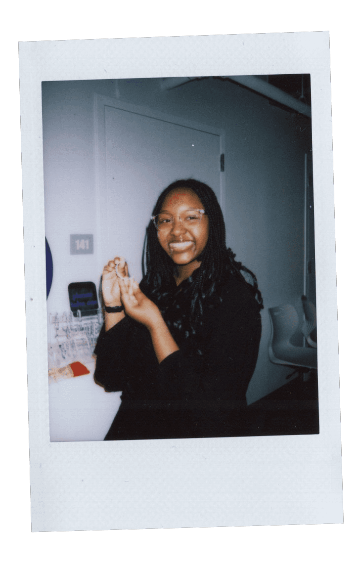 Fujifilm photo of a girl holding a friendship bracelet