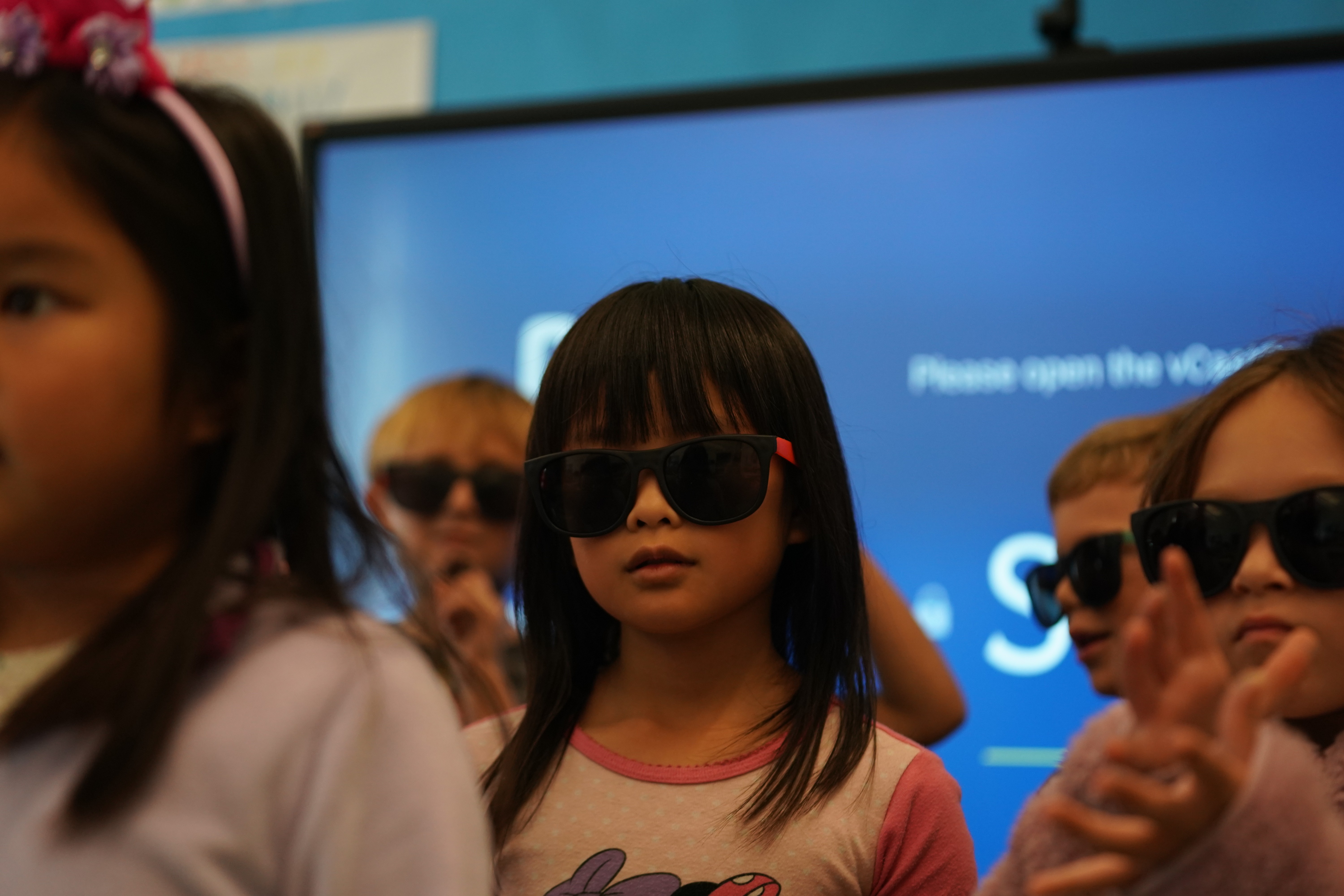 Middle school students performing on stage during musical theater enrichment program
