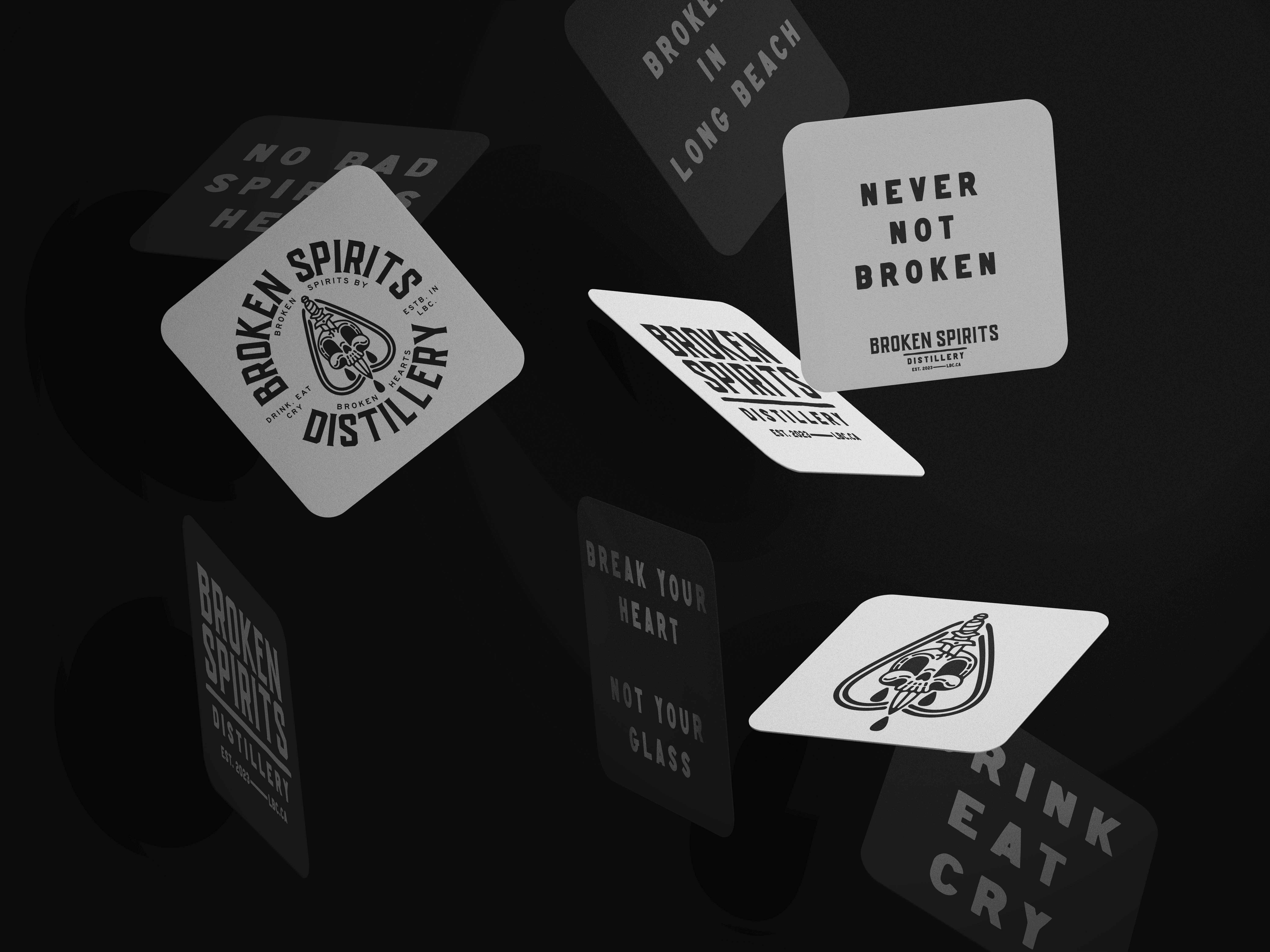 Broken Spirits black and white coasters with logo