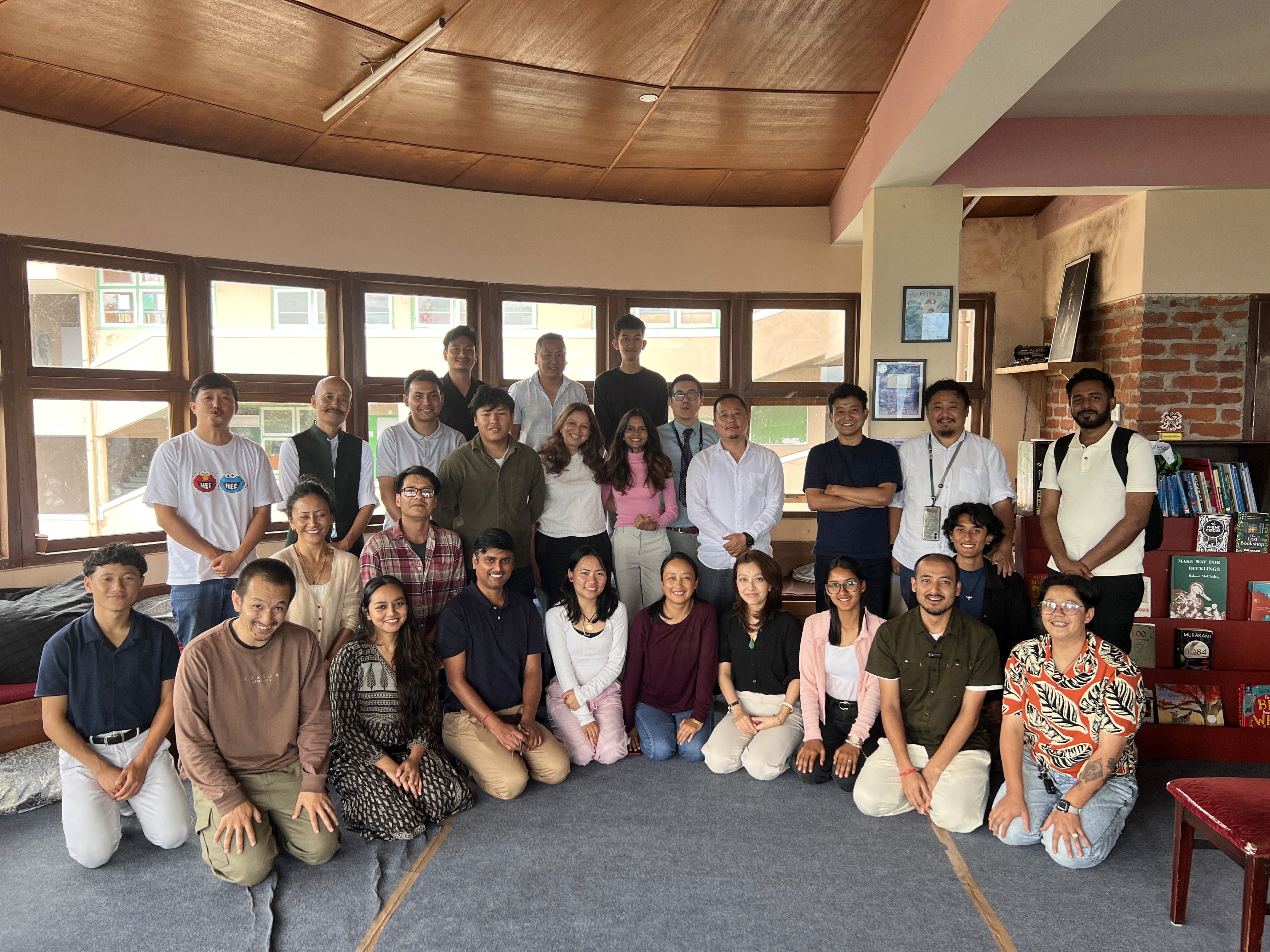 group of people sitting on bench near trees duting daytime