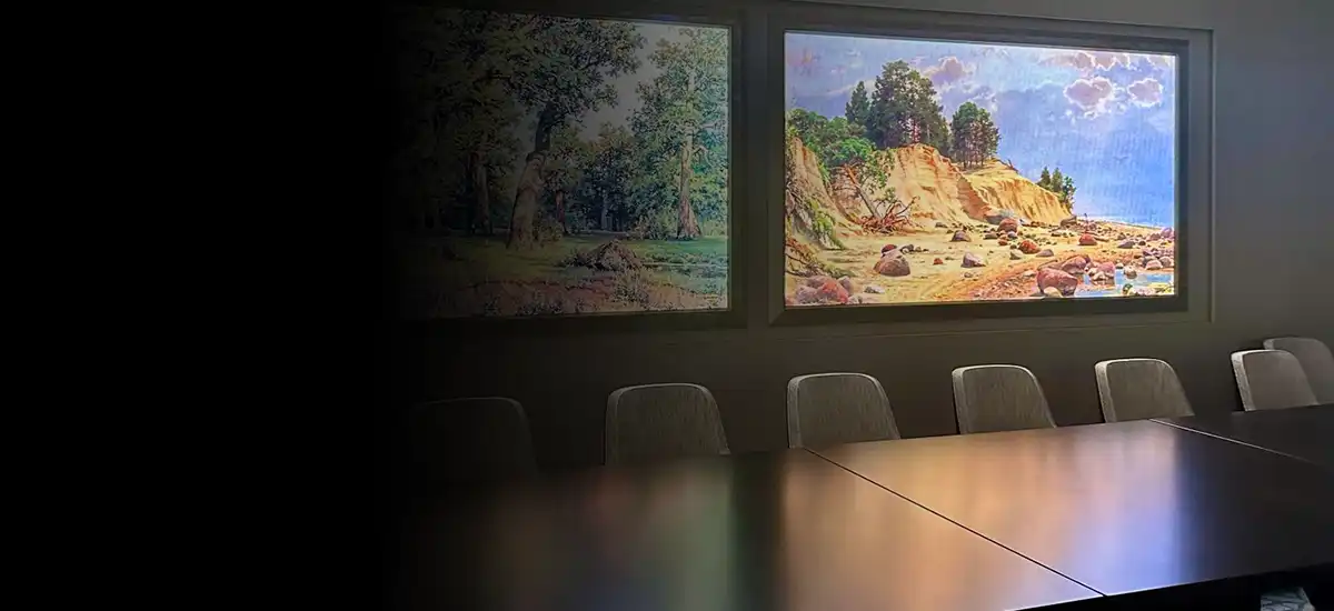 Boardroom with dual large-format displays for presentations and collaboration