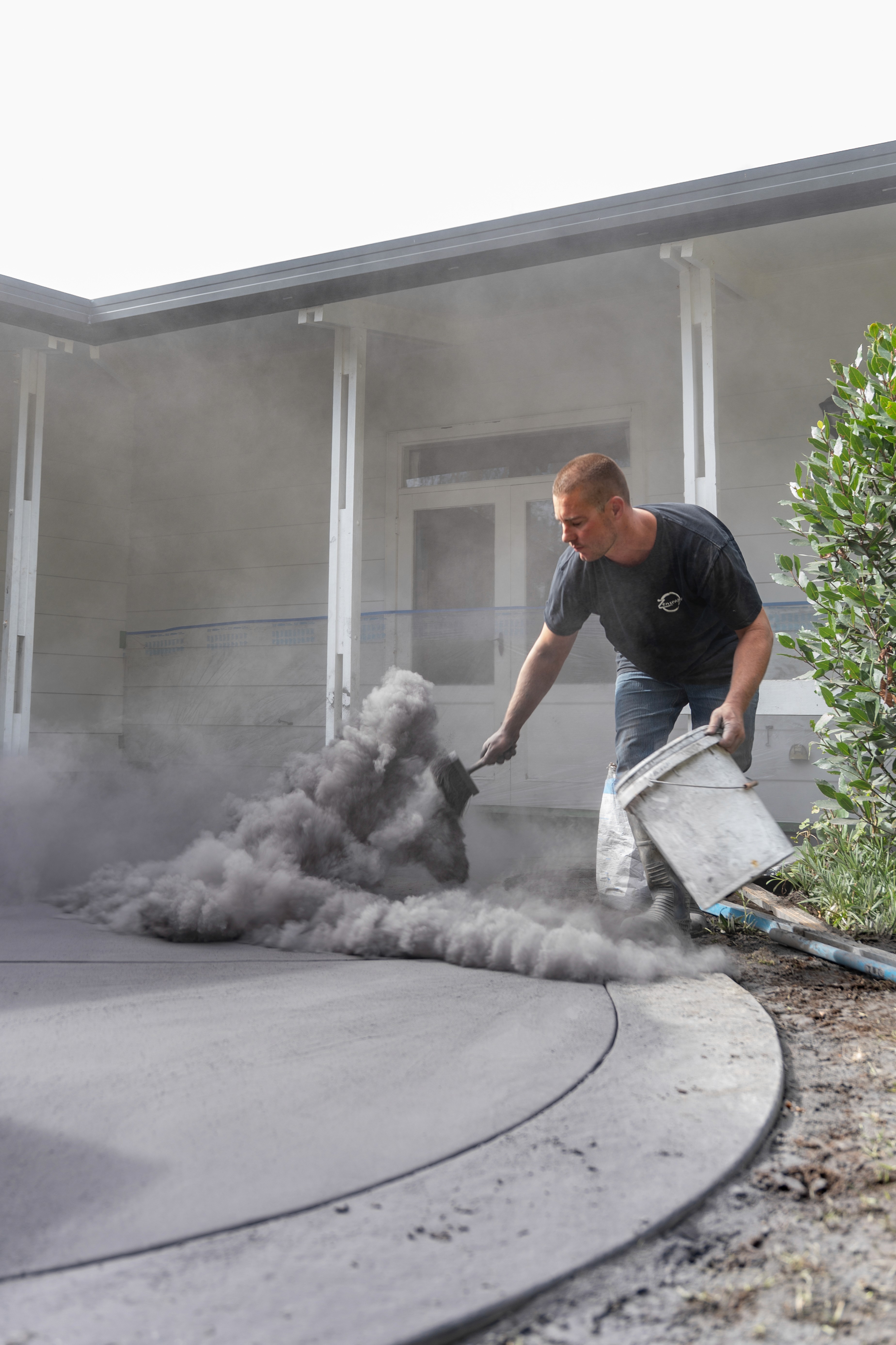 Streetside billboard with flyposters of the Batch.Works brand and illustrations