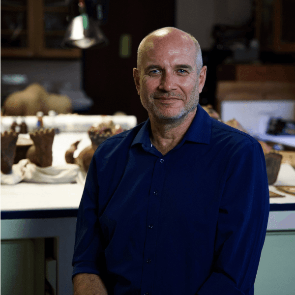 Christian de Brer with a blurred background of a conservation lab behind him