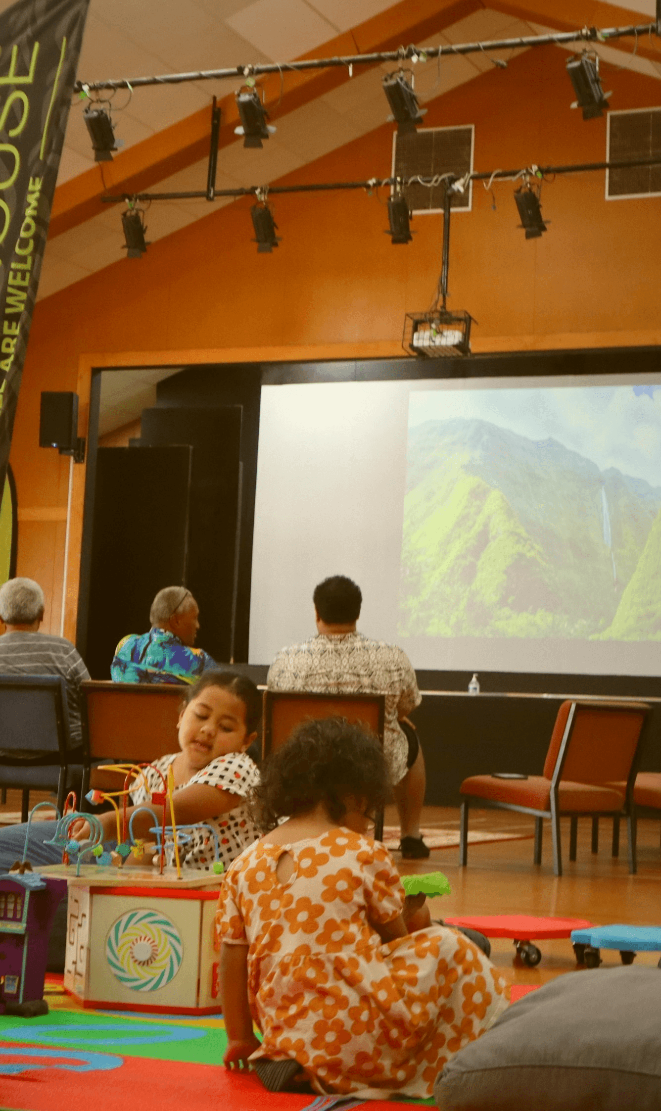 Kids playing while adults are talking