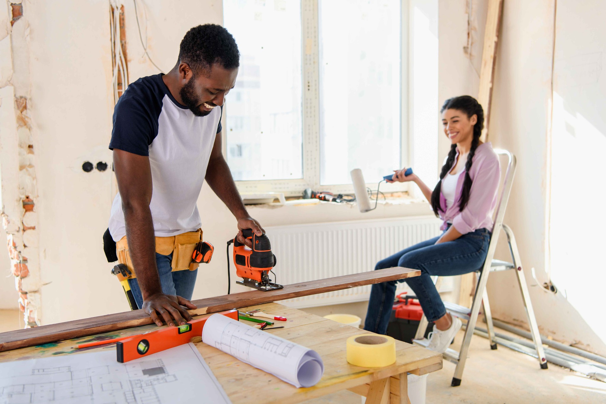 Two people renovating the property.