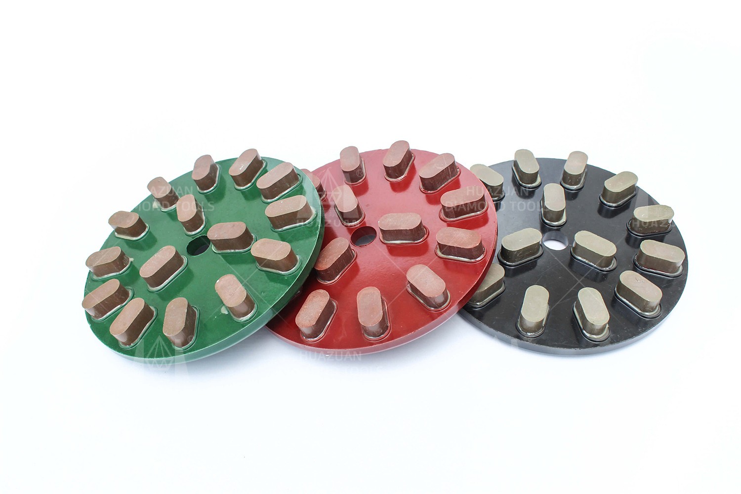 Three Metal/Resin Bond Grinding Discs in red, green, and black colors placed side by side.