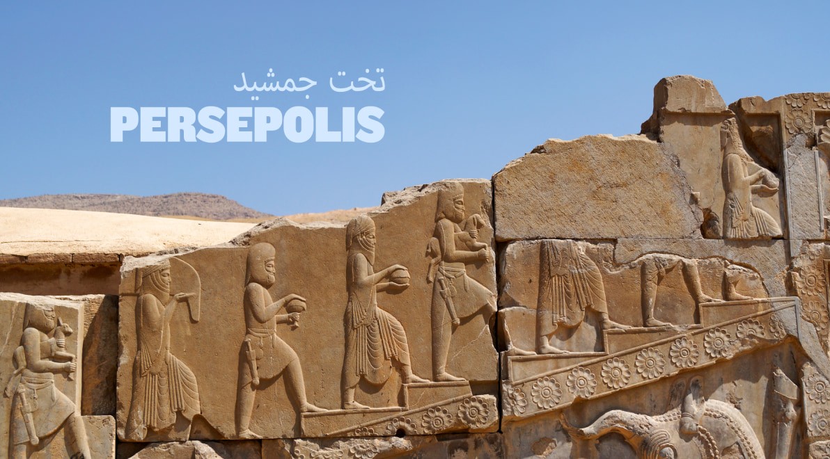 Bas-relief carvings of tribute bearers in procession along the Apadana staircase at Persepolis.