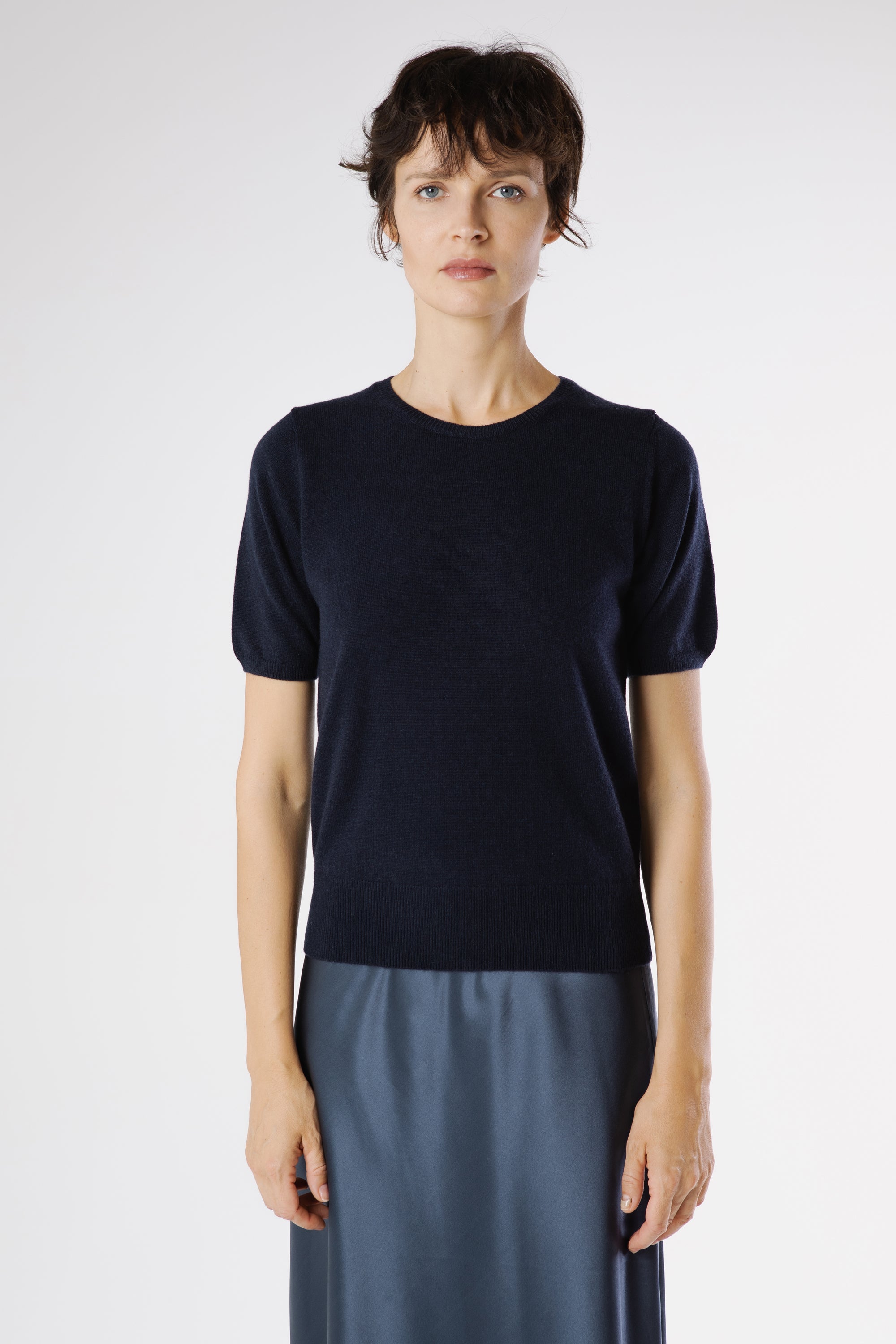 Front view of the Magda Cashmere Pullover Beluga in deep navy, highlighting its clean silhouette and refined short sleeve design.