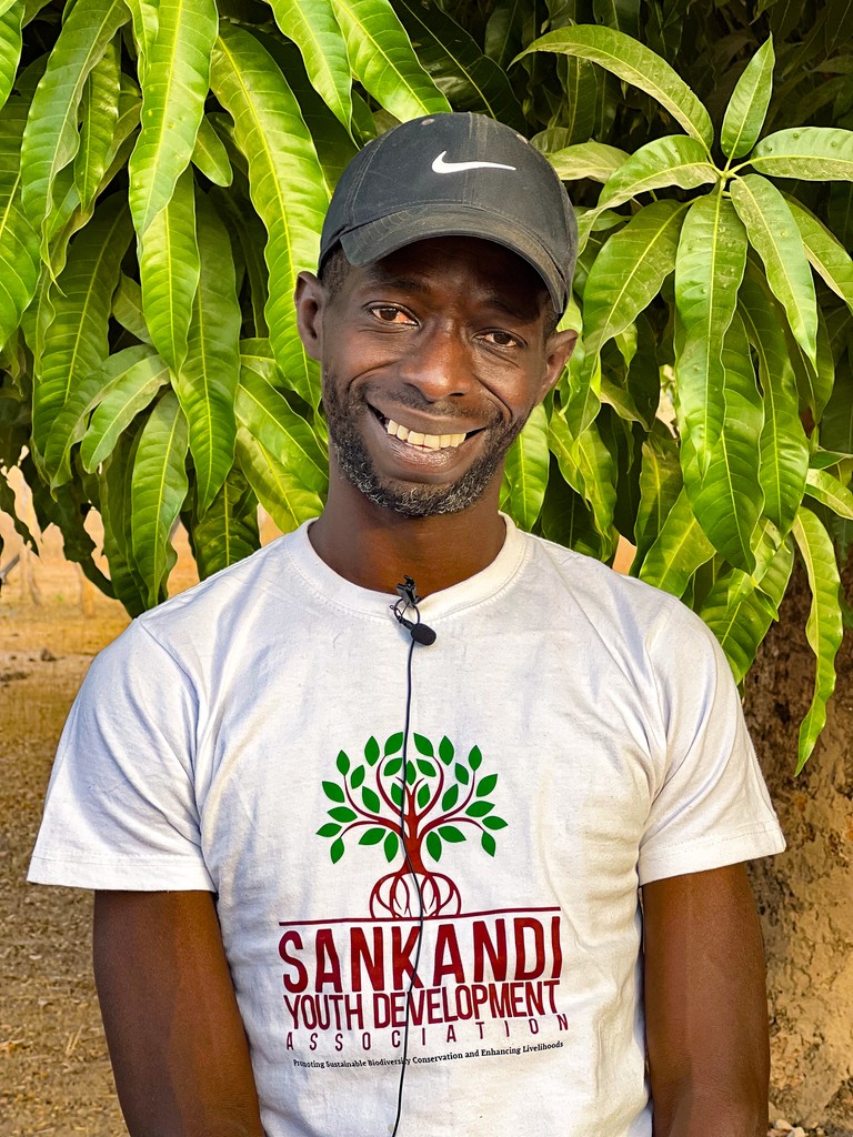 Portrait of a young adult man in front of mangrove leaves