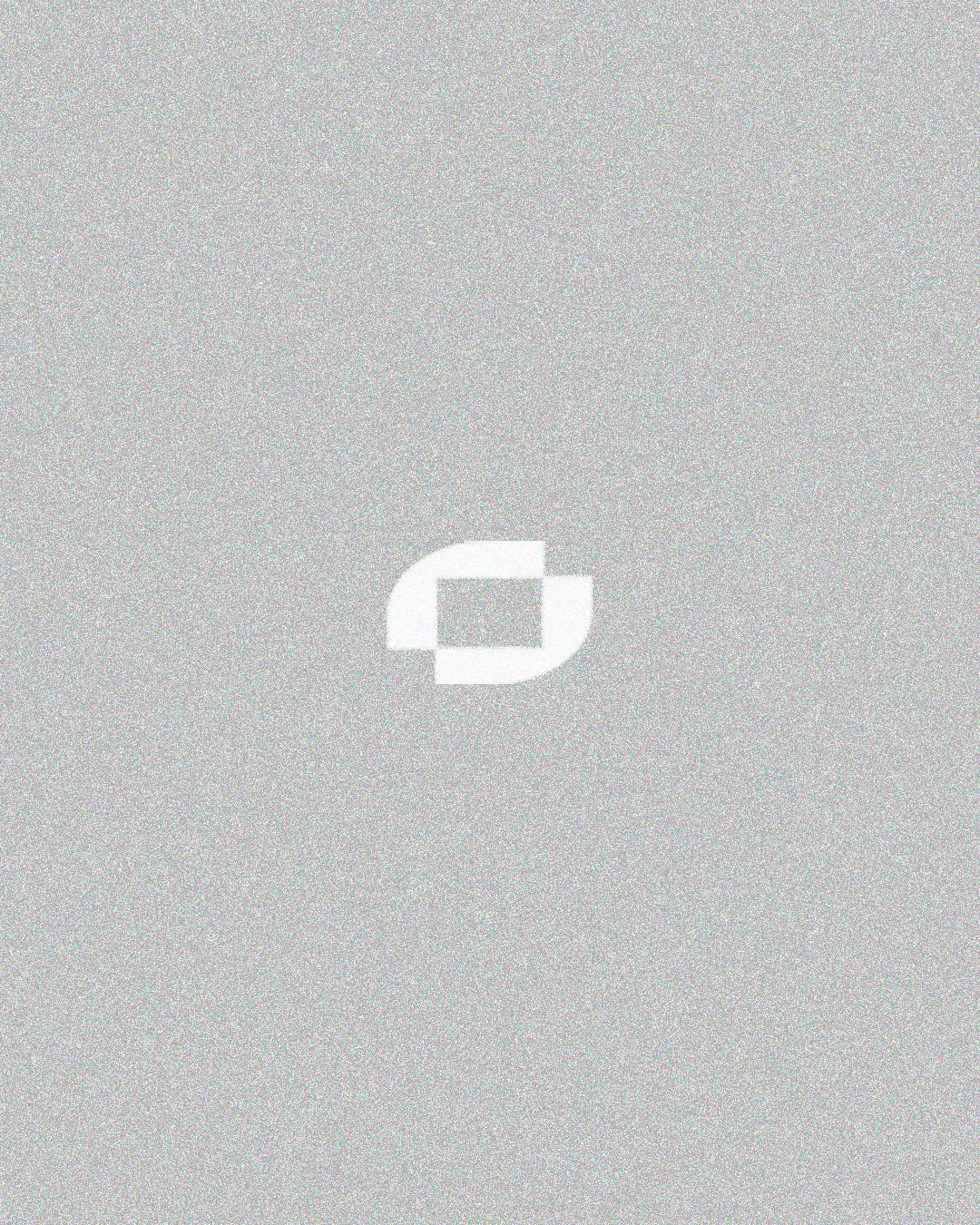 Portrait of a woman with long, smooth hair swept to the side, in a dark t-shirt, on a plain background.