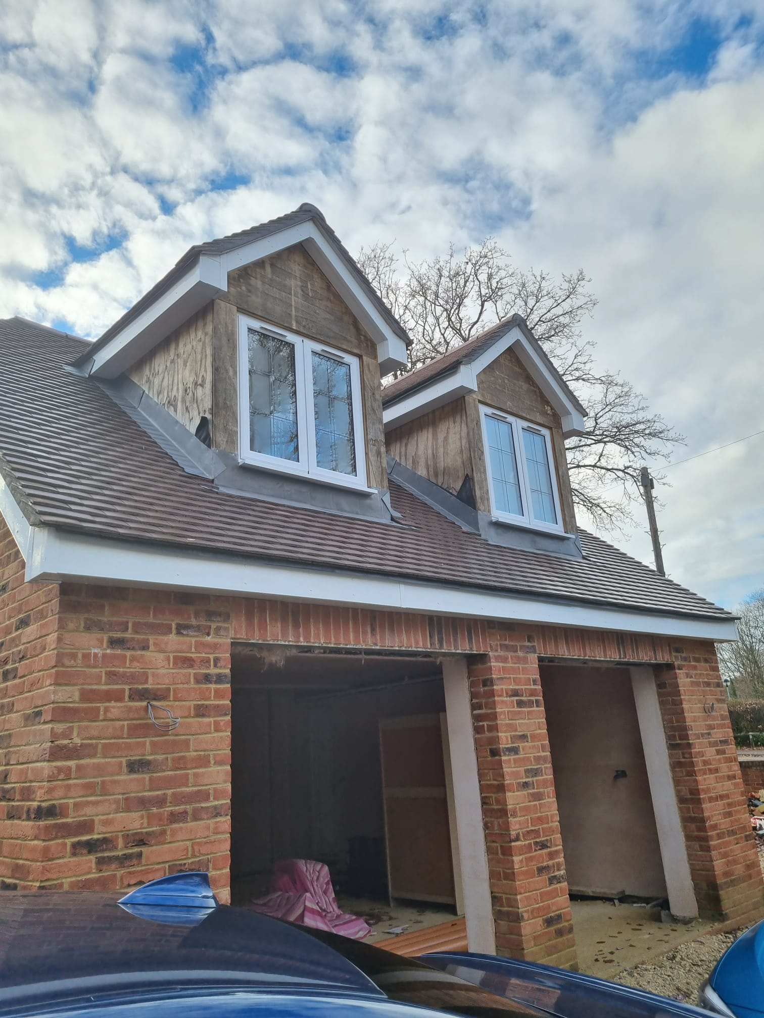 brown wooden kitchen cabinet near white wall