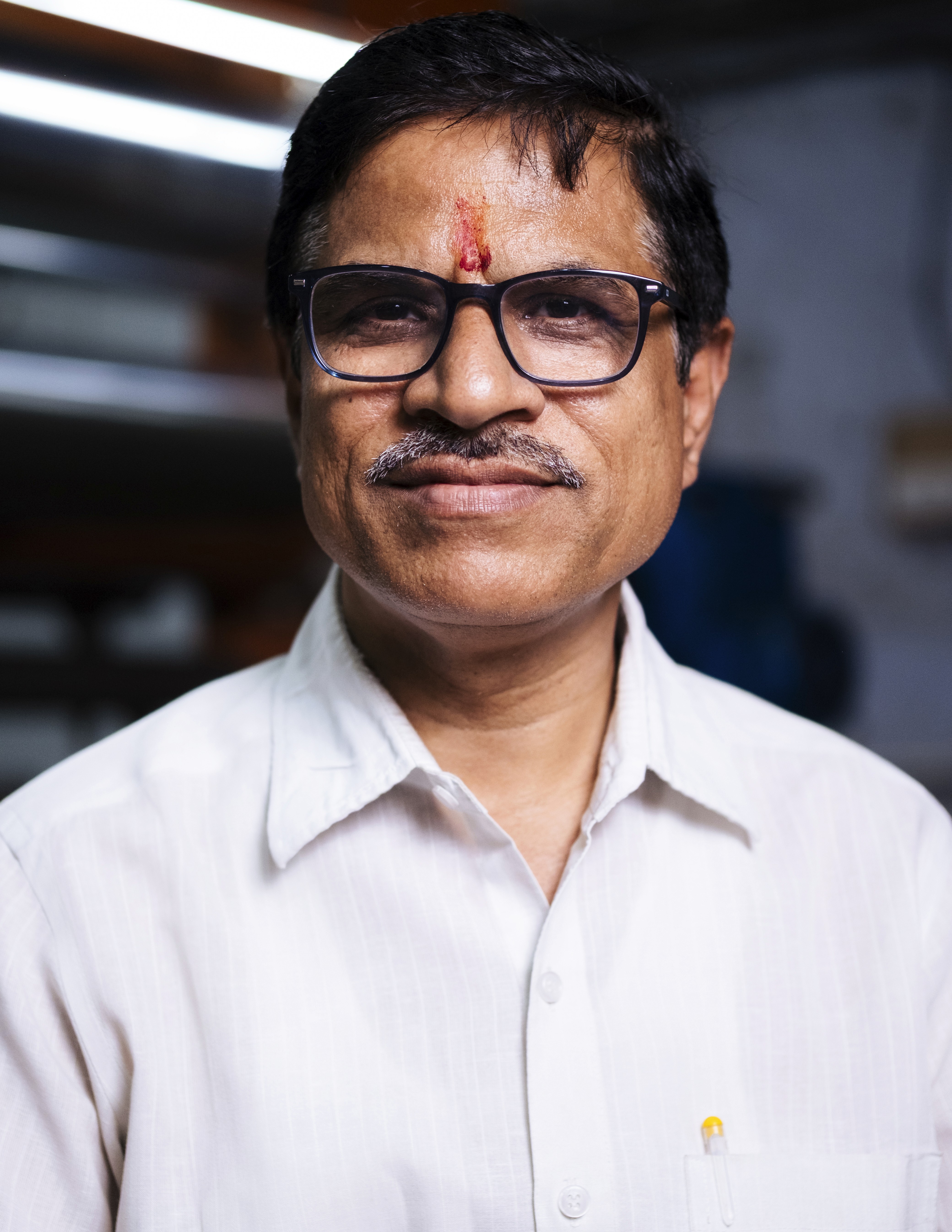Man smiling in an office