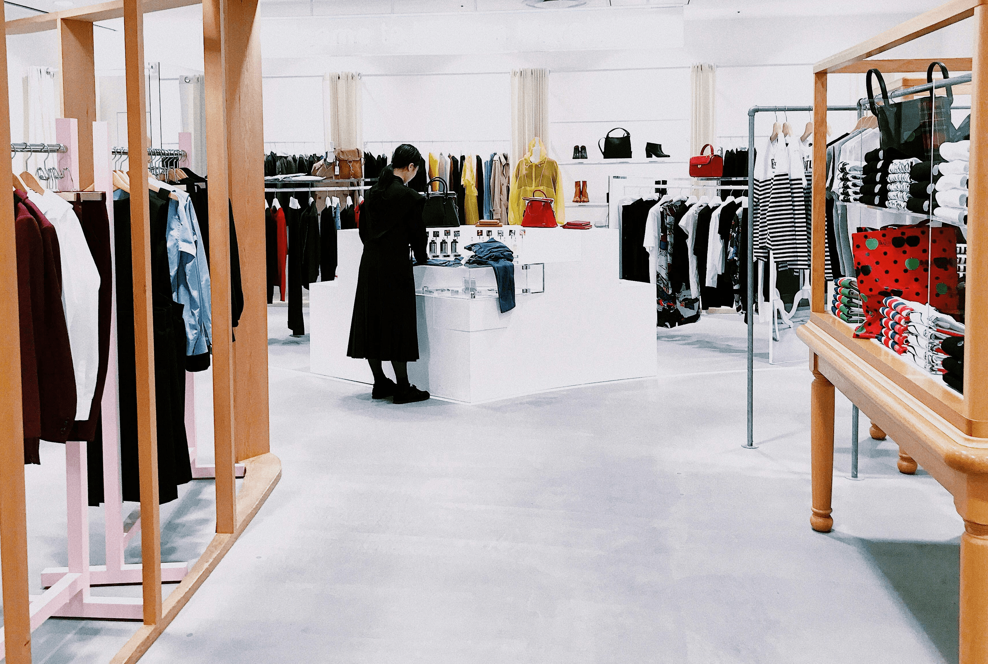 woman standing inside clothing area