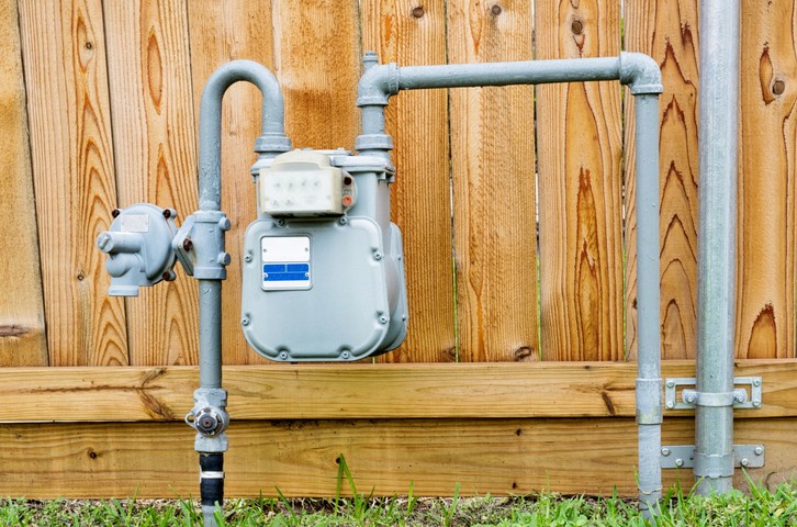 Residential gas line installation in a Toronto home front yard