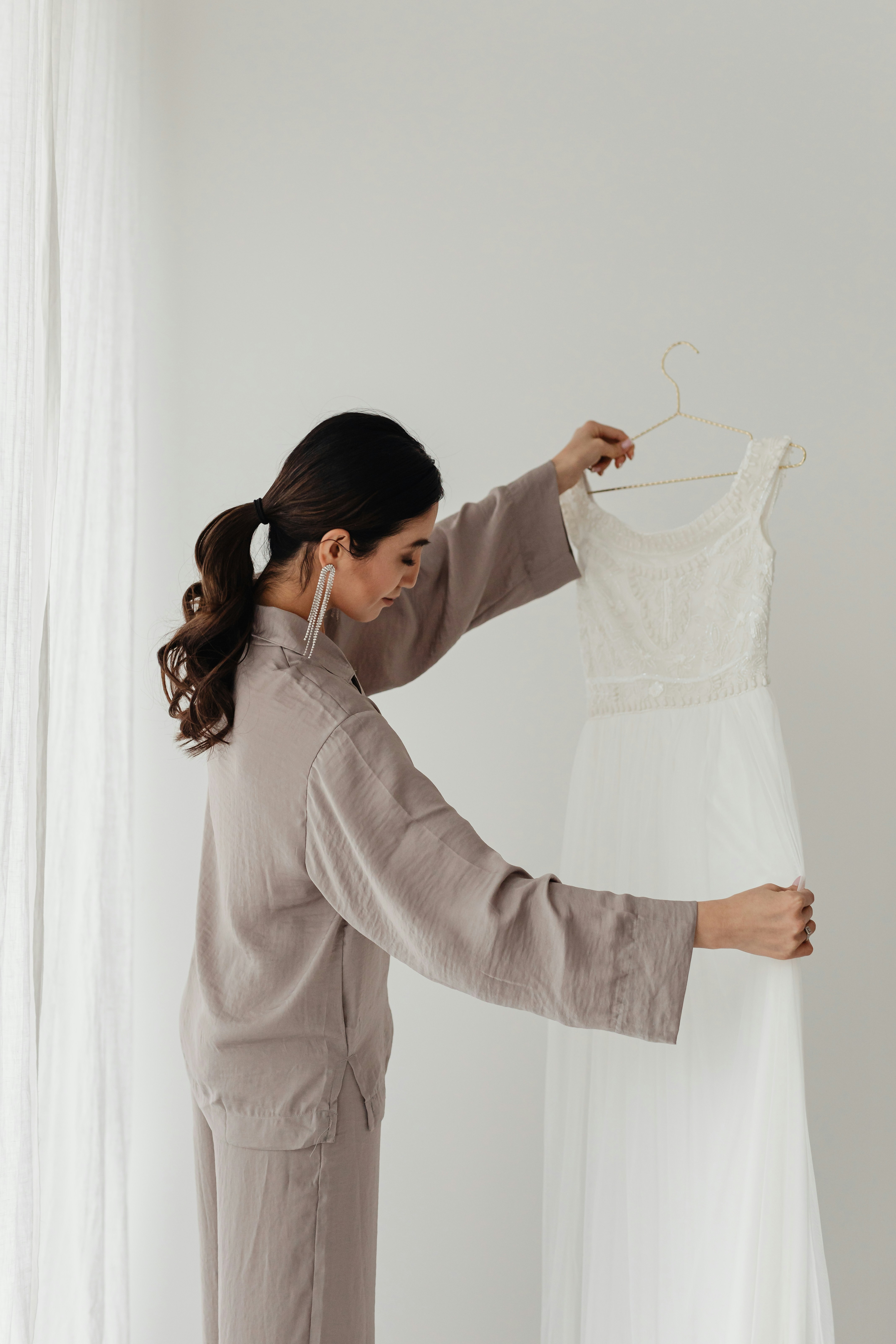 A bride holding a wedding dress