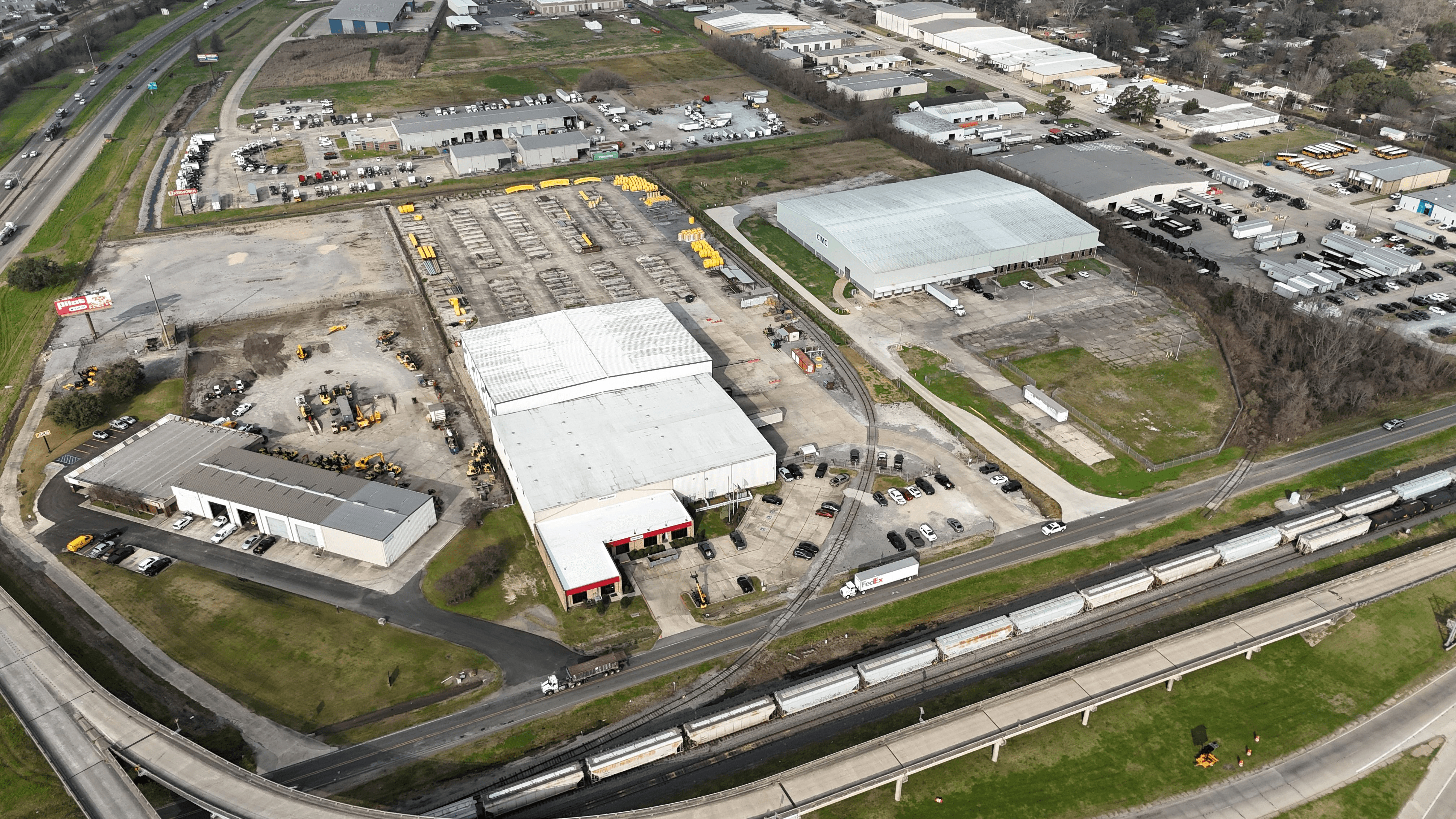 Aerial view of the MRC Global Port Allen industrial property with outdoor storage and surrounding warehouses.