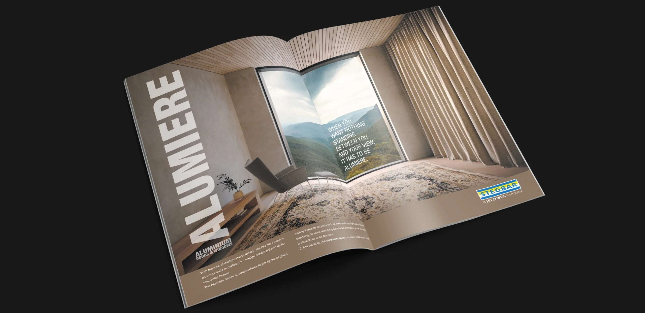 Stegbar Alumiere spread with a window framing a mountain view: 'When you want nothing standing between you and your view'