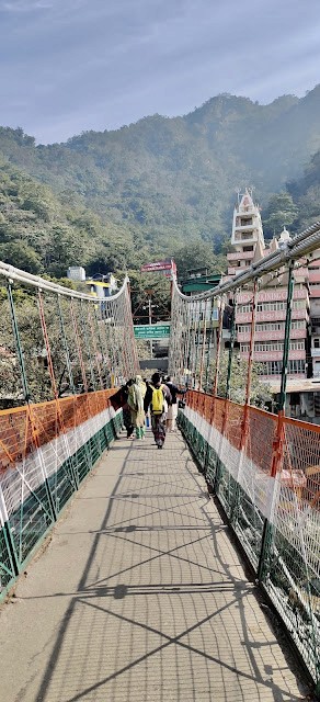Laxman jhula with temples in the background.