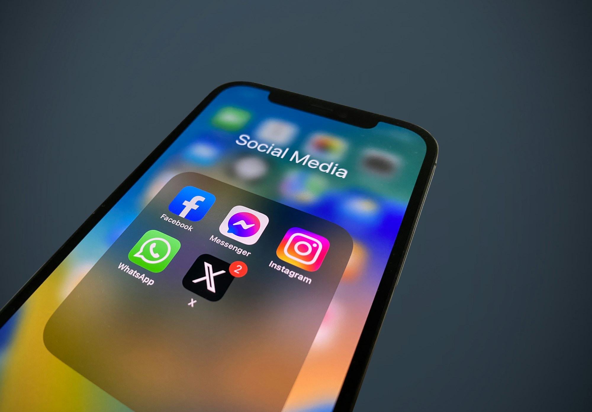 a close up of a phone with social media icons