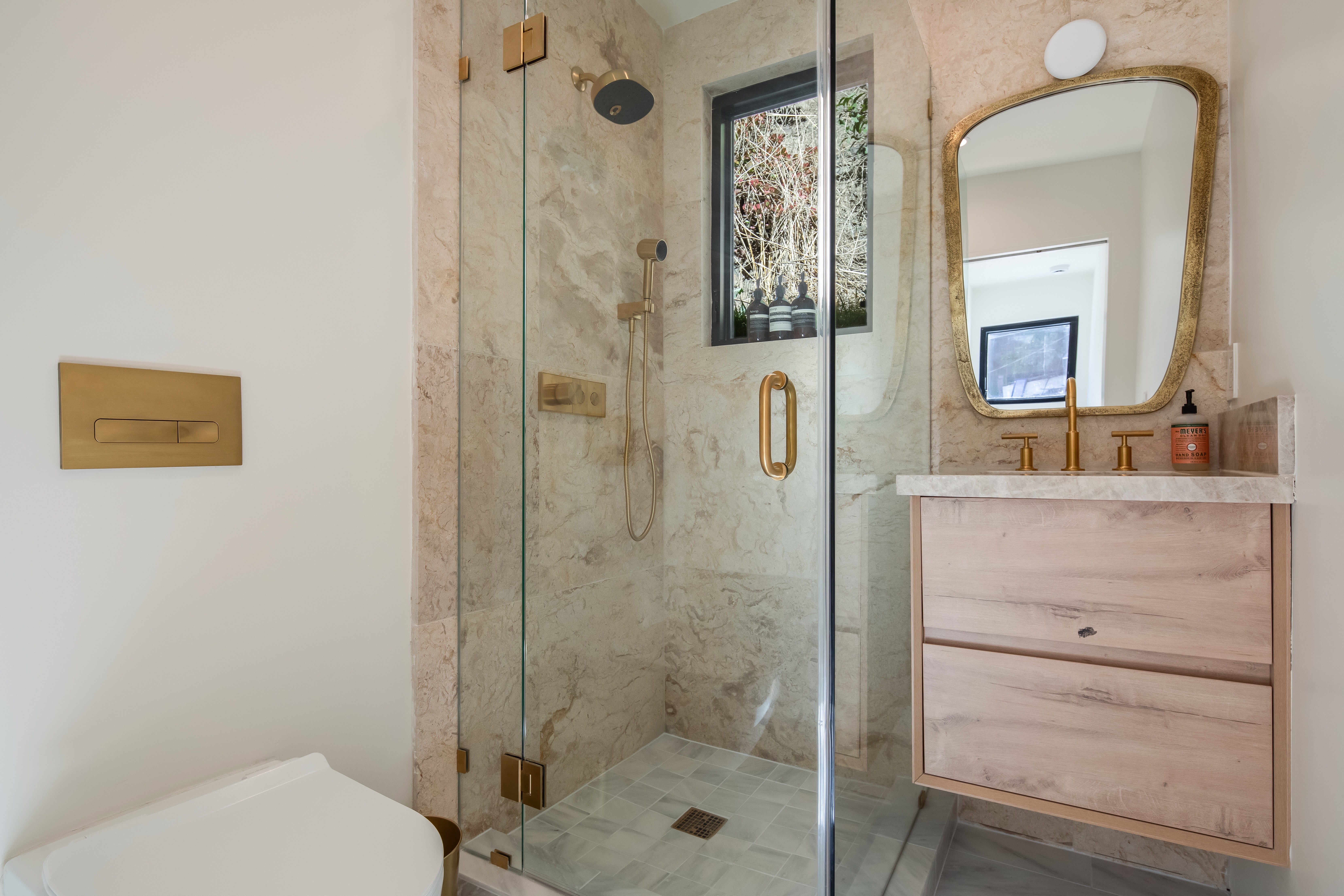 Dining area with red chairs and a view of the living room