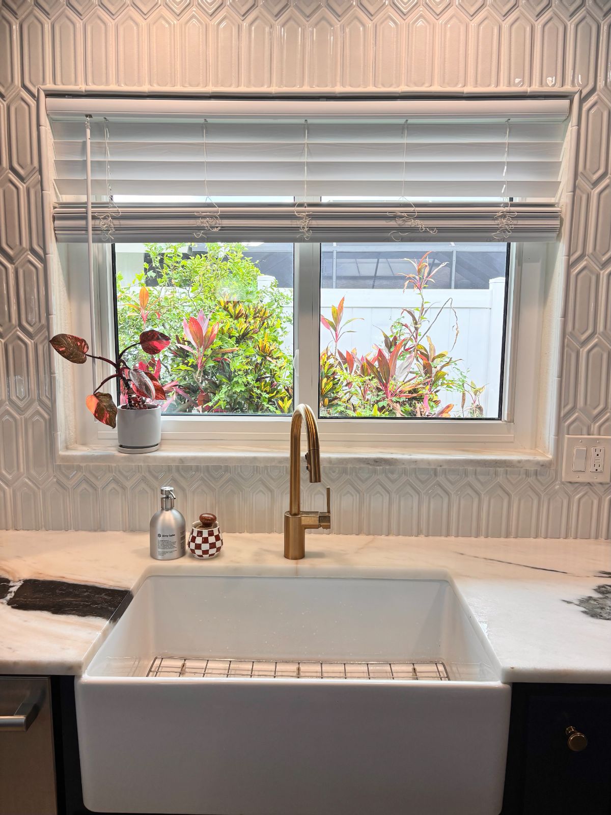 Brushed gold tap and farmhouse sink