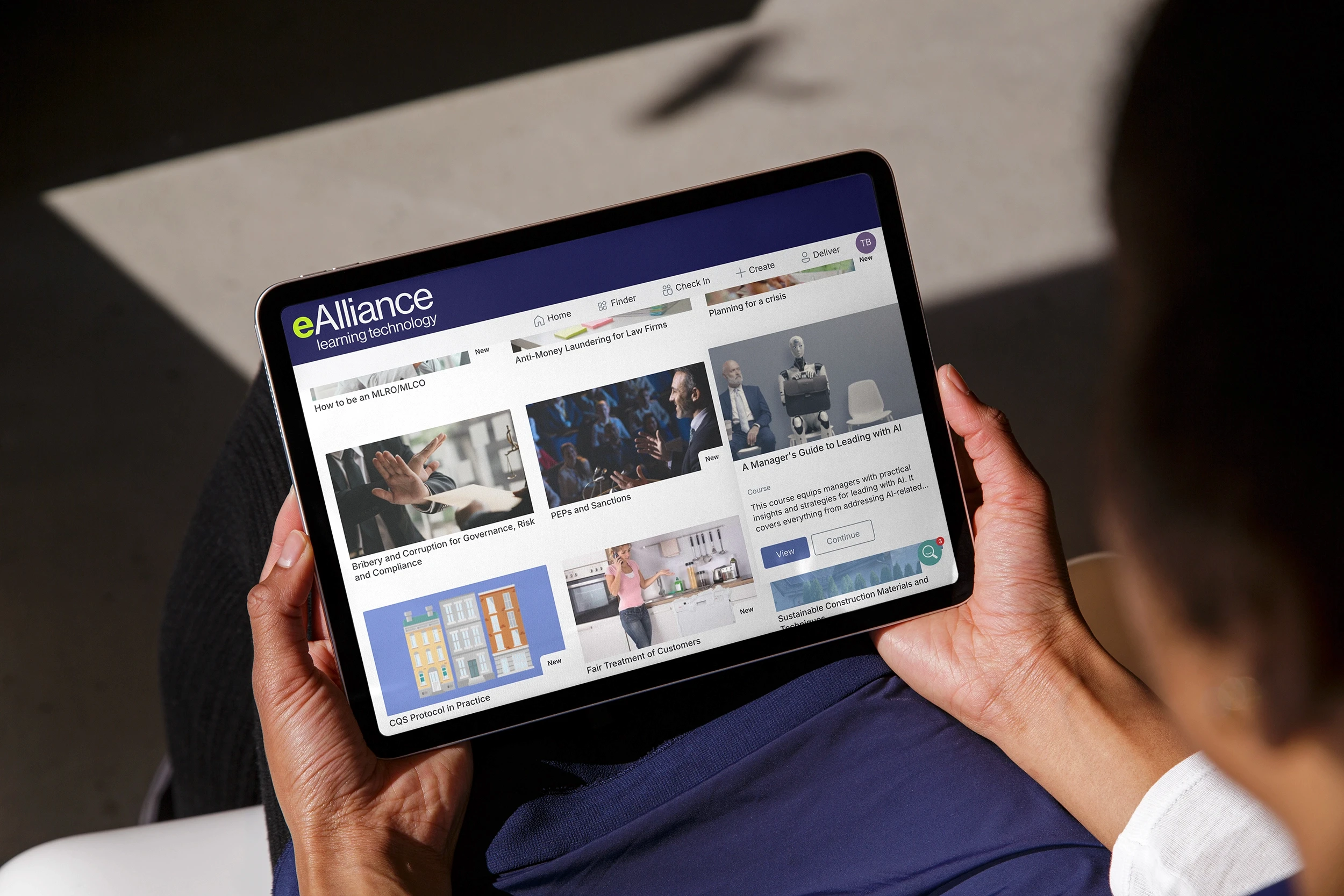 Businness man sat on bench using ipad to access ealliance platform