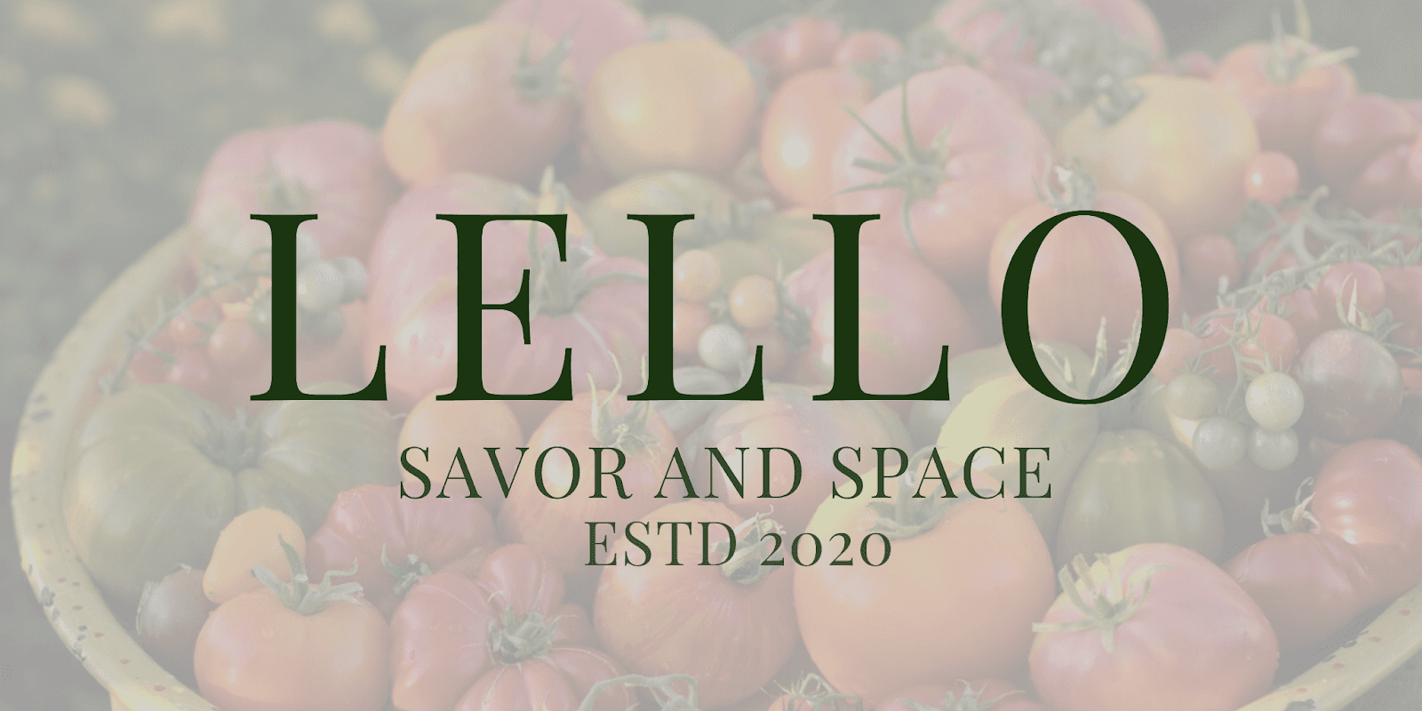 A bowl filled with ripe tomatoes, accompanied by the words "lello," "savor," and "space" in an elegant font.