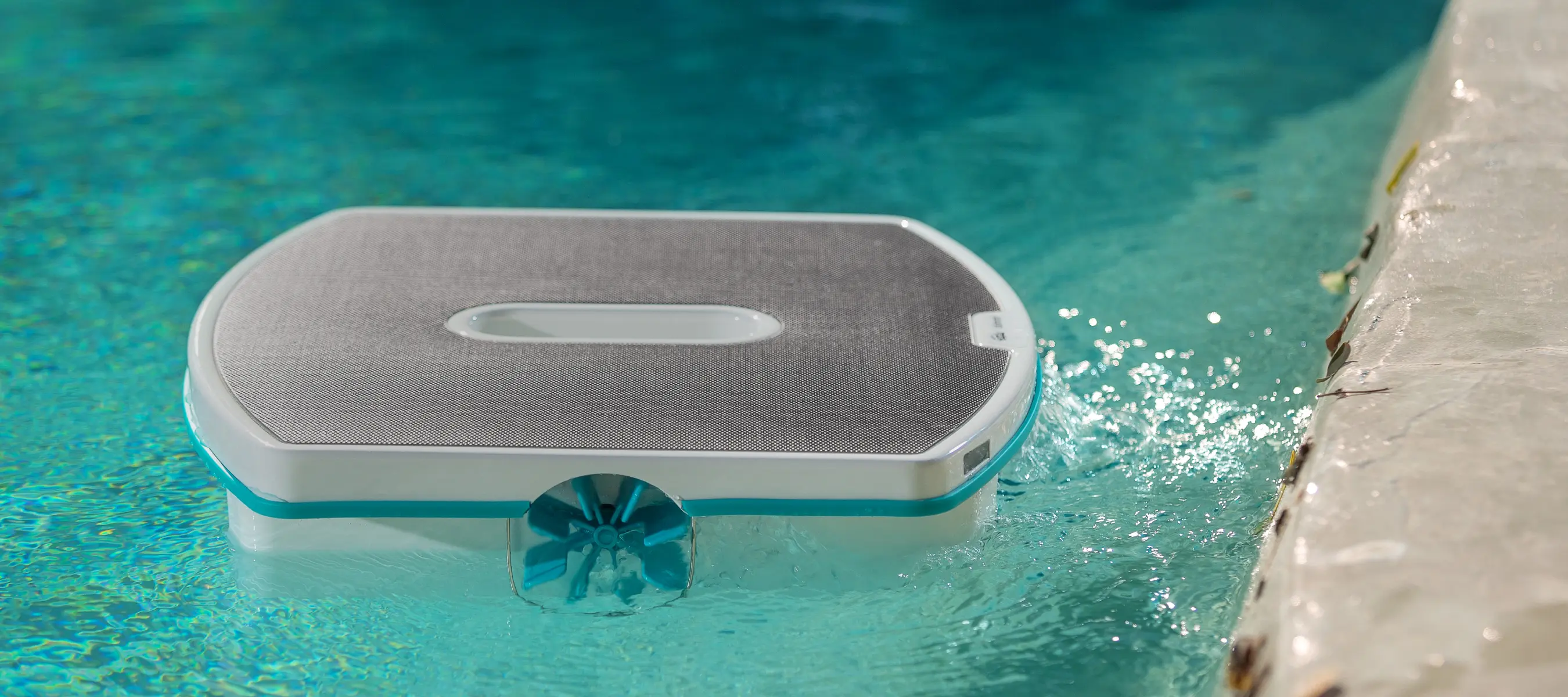 The Dolphin Skimmi floating on a sparkling pool surface