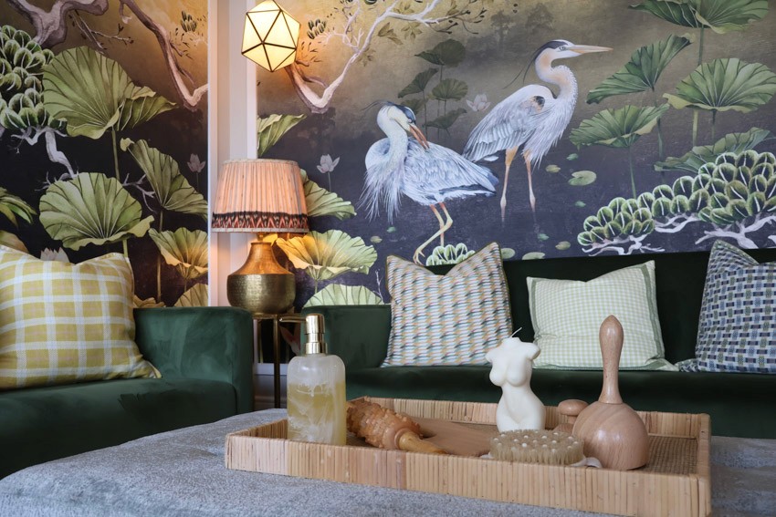 landscape image of beauty tools organised neatly, mural of birds on wall