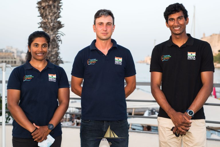 A man standing with Sufboard