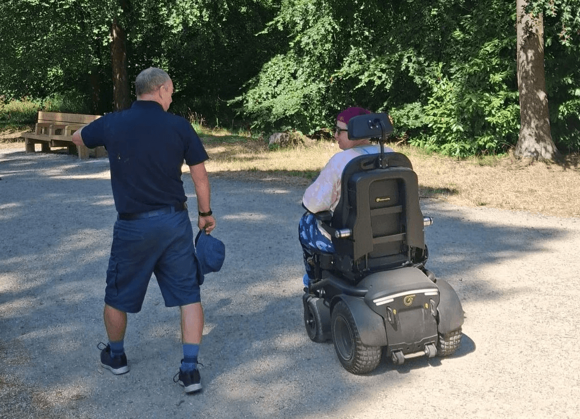 Attendee-trialling-Freedom-powerchair-with-SDL-staff