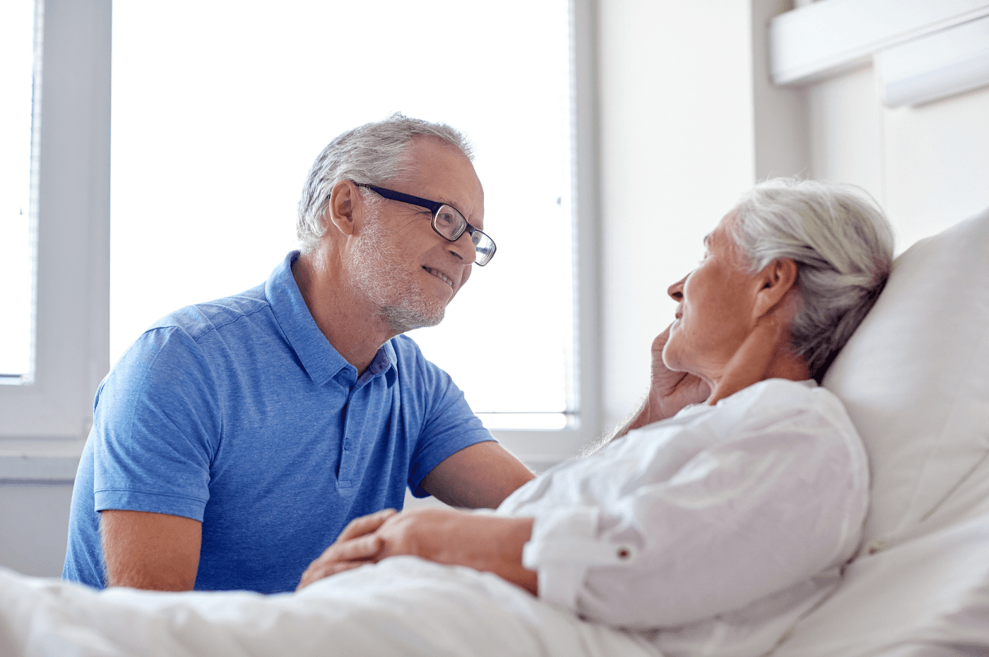 senior couple meeting at hospital ward