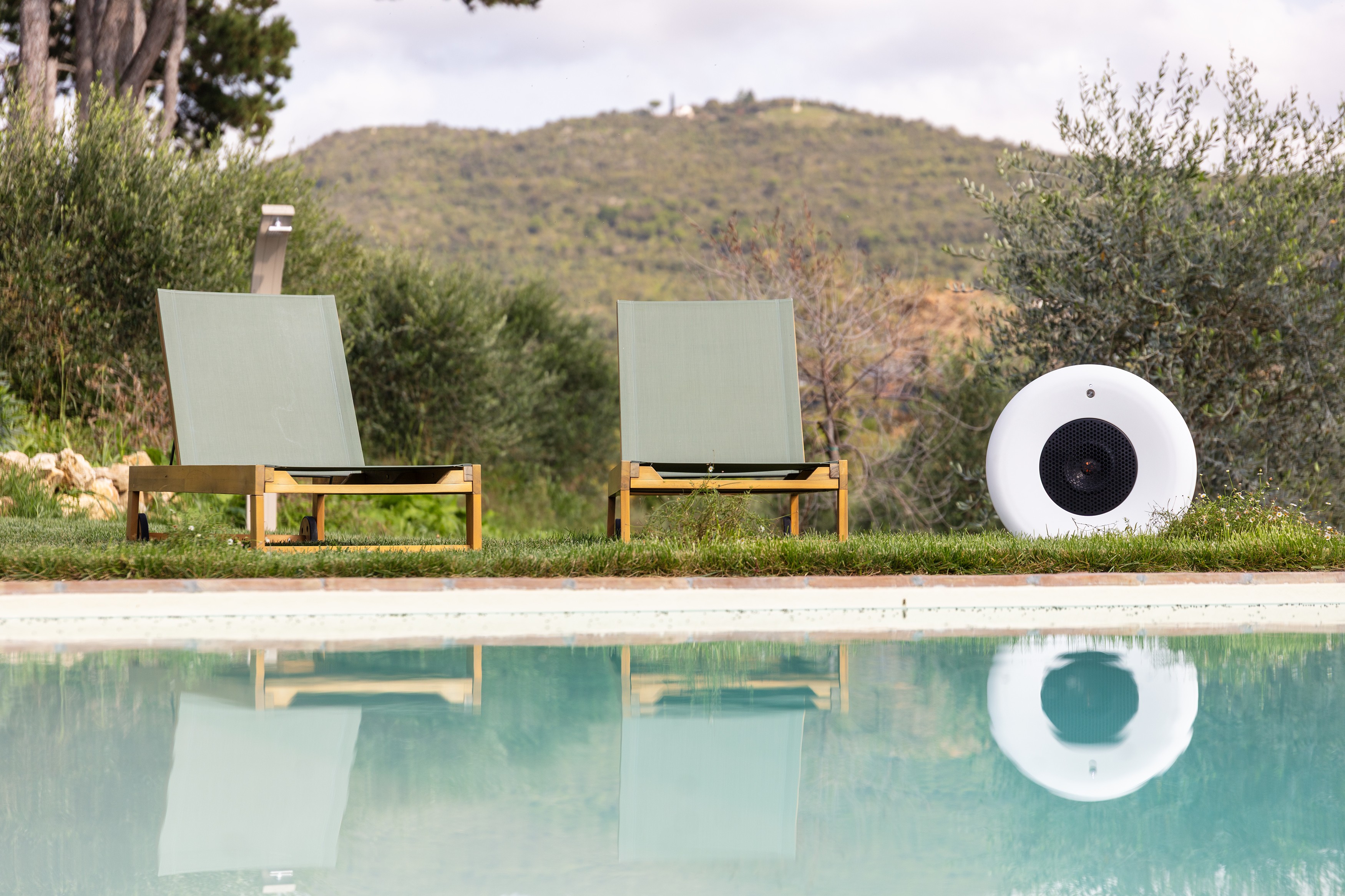 Streetside billboard with flyposters of the Batch.Works brand and illustrations