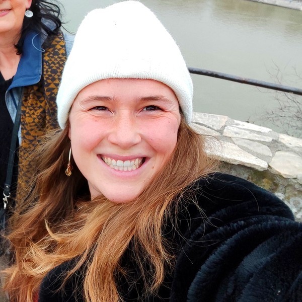 woman smiling wearing denim jacket