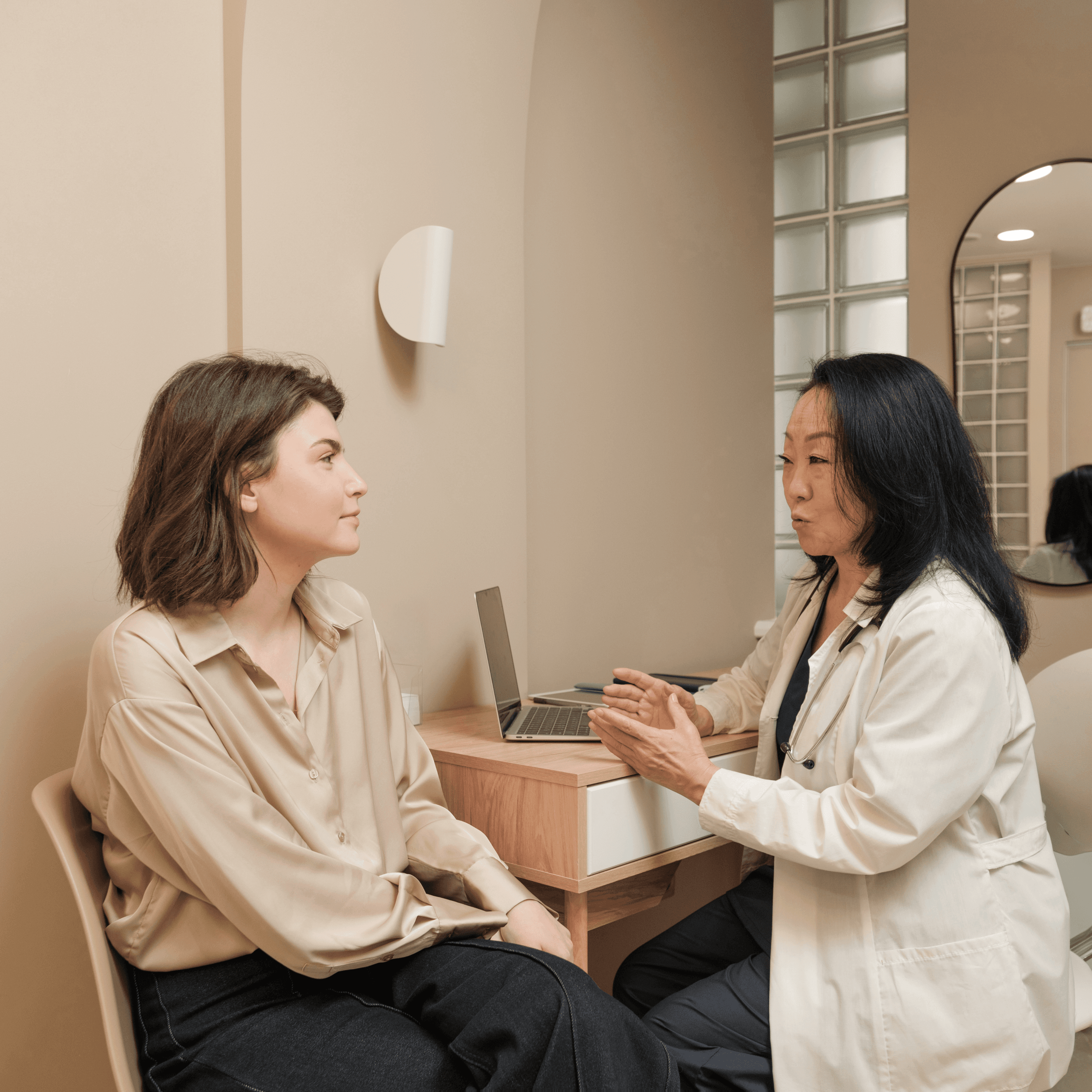 Doctor speaking with a woman during a specialist women’s health consultation