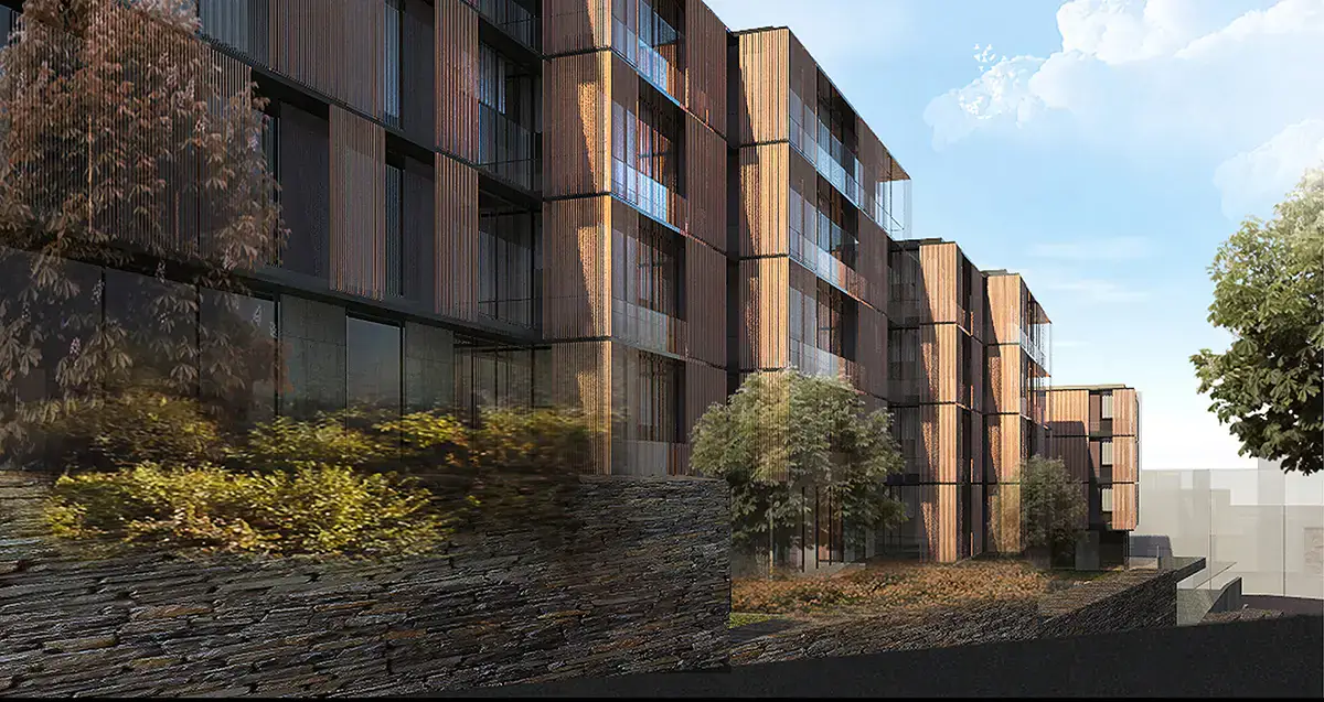 Side elevation of the housing blocks with a stone wall