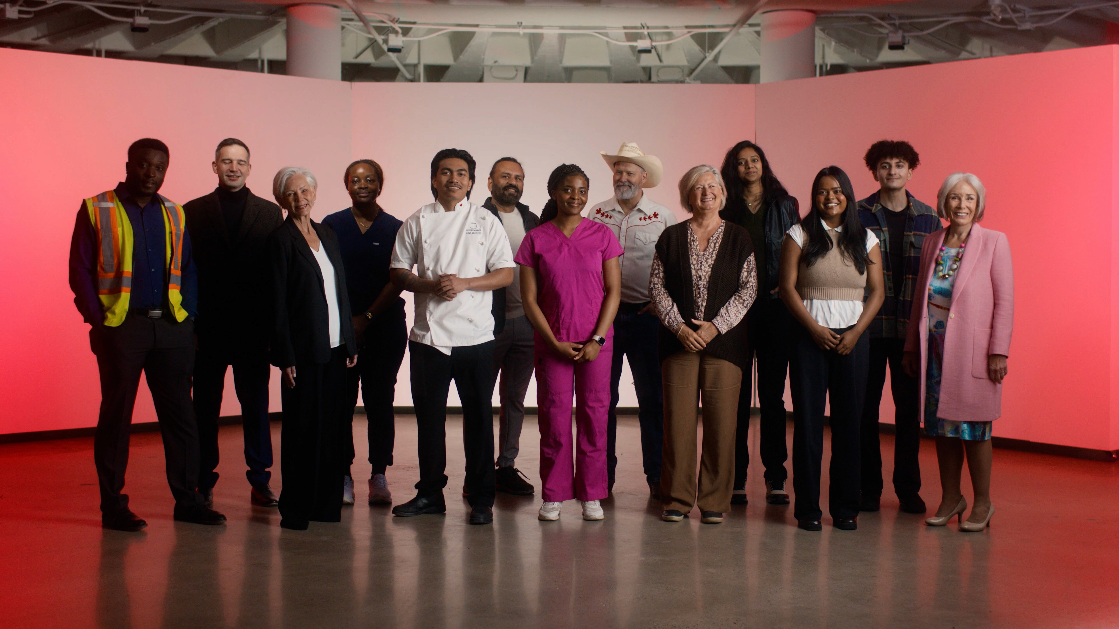 A group photo of all our different Canadian workers in their respective uniforms for Canada day smiling at us.