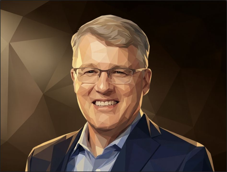 Person wearing glasses and a blue shirt smiling.