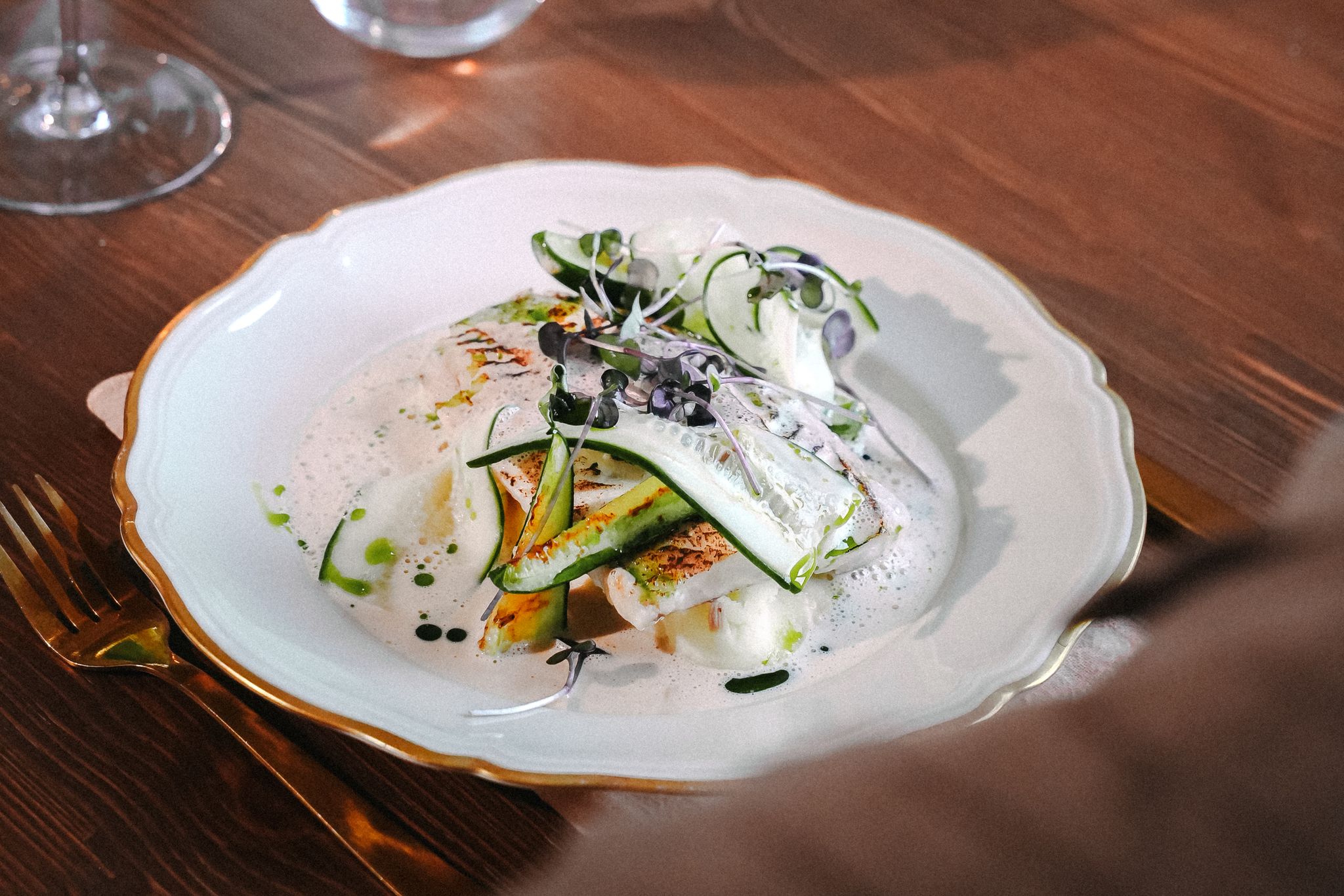 stainless steel fork and knife on white ceramic plate