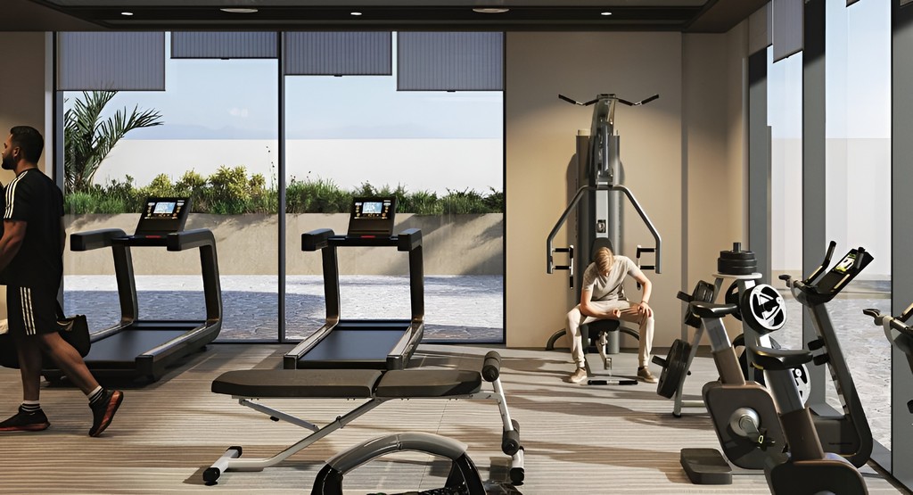Aizel Tower gym room with a treadmill positioned near a large window, creating an inviting exercise space.